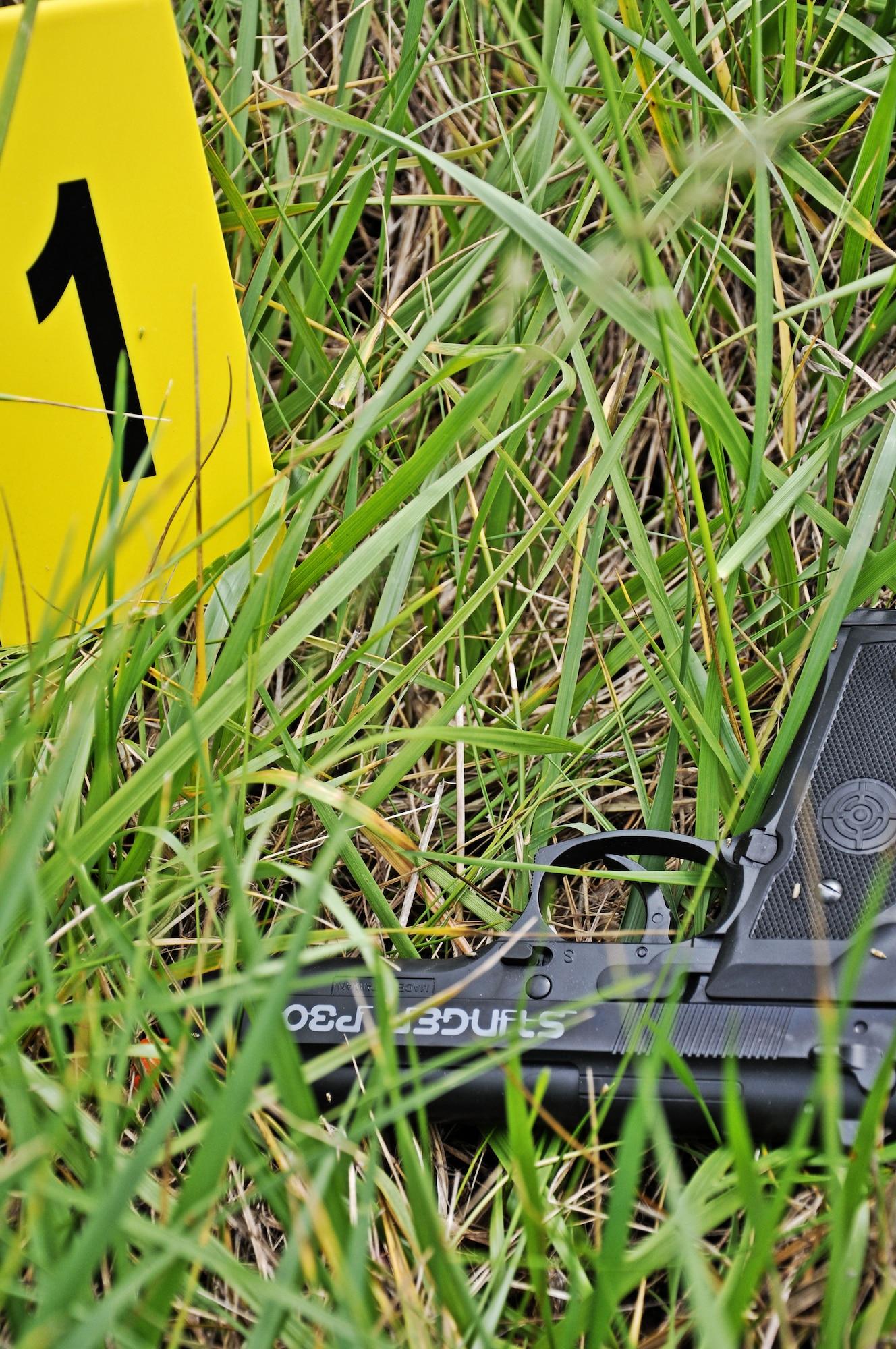 A piece of evidence was found during a training scenario at the Mascoutah gate May 8, 2012, at Scott Air Force Base, Ill. Participants of the training had to document the scene, investigate why it happened and find out where the injured criminal had fled to through photographs, evidence, blood testing technology and a variety of other techniques and technology. (U.S. Air Force photo/Airman 1st Class Jake Eckhardt)