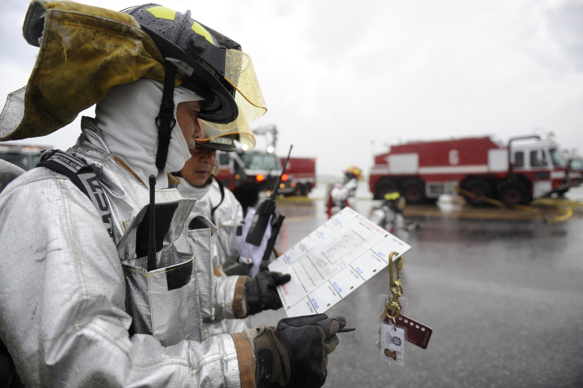 Kadena firefighters review a checklist while responding to a simulated aircraft fire during Beverly High 12-4, a local operational readiness exercise, on Kadena Air Base, Japan, May 16, 2012. LOREs are conducted on a regular basis to test the base's ability to defend Japan and maintain peace and stability in the Pacific region. (U.S. Air Force photo/Airman 1st Class Maeson L. Elleman)