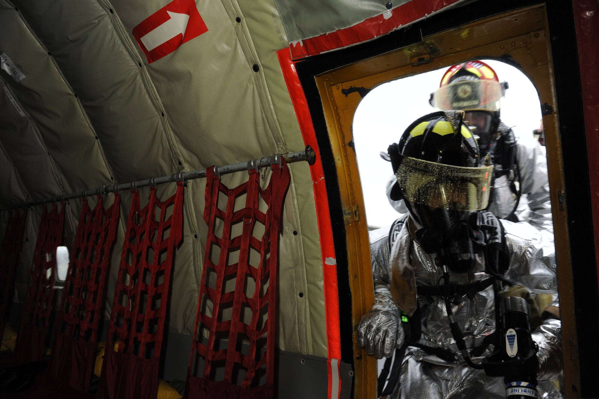 Kadena firefighters prepare to enter a simulated burning KC-135 Stratotanker aerial refueling aircraft during an emergency management exercise (EME) taking place during local operational readiness exercise Beverly High 12-4 on Kadena Air Base, Japan, May 16, 2012. LOREs give Airmen the opportunity to practice readiness skills and prepare for future real world contingencies. (U.S. Air Force photo/Airman 1st Class Maeson L. Elleman)