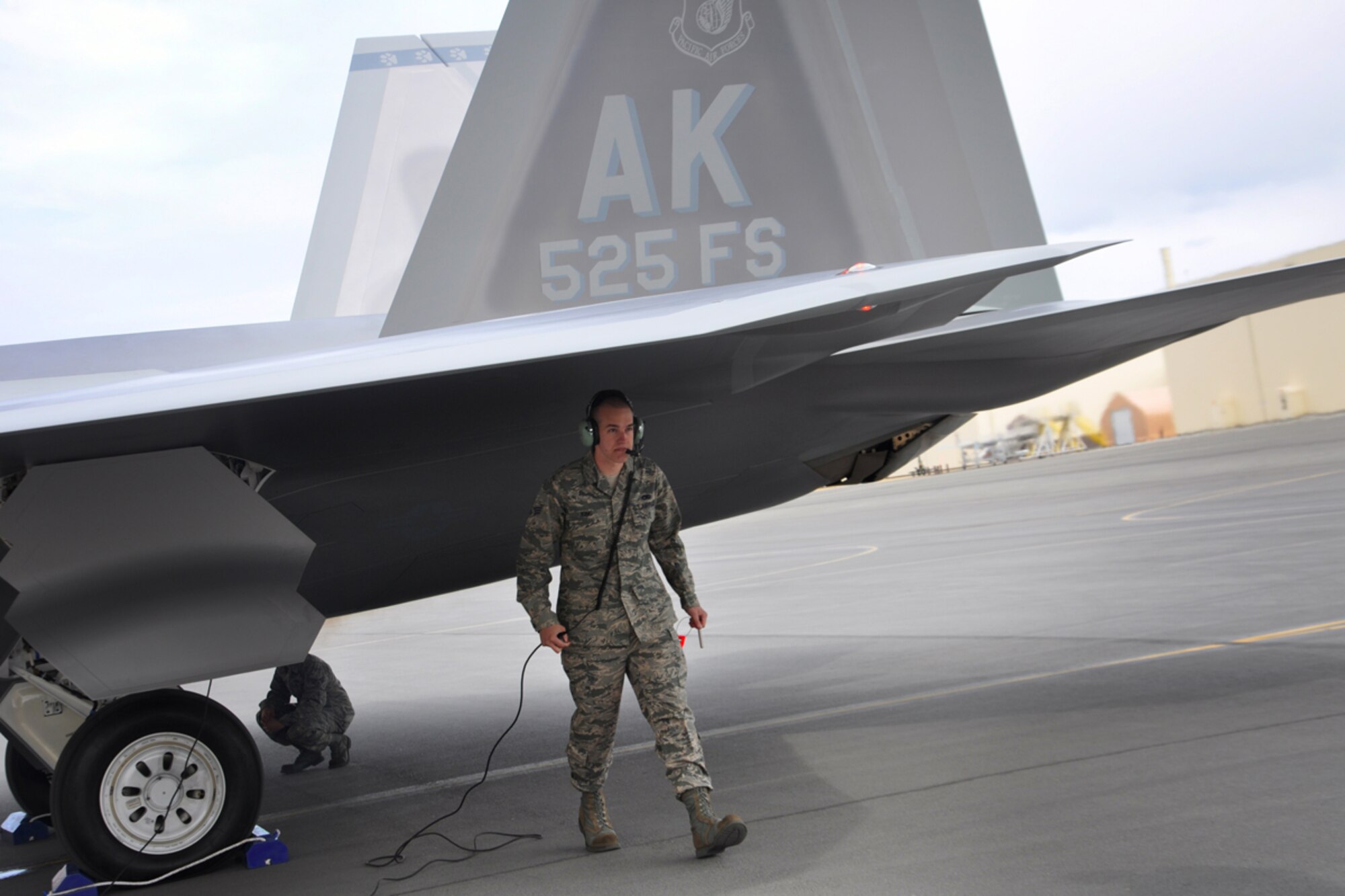 Senior Airman Joshua King performs post flight checks on an F-22 on the flightline May 5. The 525th Fighter Squadron, 3rd Wing, Joint Base Elmendorf-Richardson, received the last F-22 Raptor being made from Lockheed Martin and has named it the squadron's flagship. King is the aircraft's assistant dedicated crew chief with the 525th Aircraft Maintenance Unit from Collinsville, Okla. (U.S. Air Force photo/Staff Sgt. Cynthia Spalding)