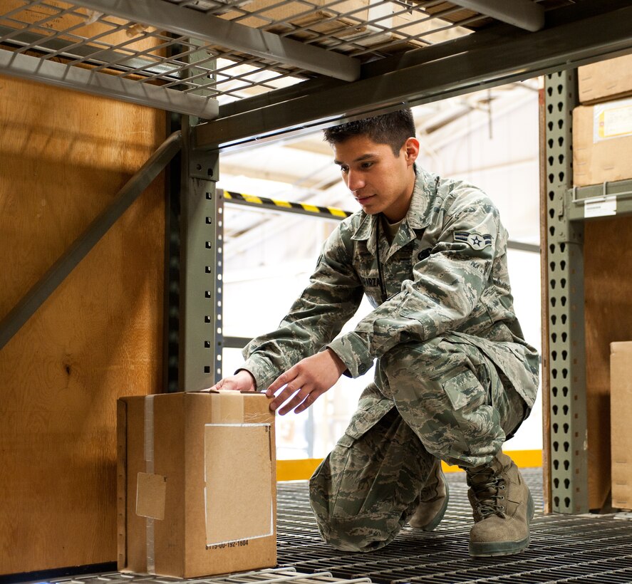 Airman 1st Class Kristopher Esparza, 28th Logistics Readiness Squadron aircraft parts store technician, stores a box at the aircraft parts store after receiving parts at Ellsworth Air Force Base, S.D., May 9, 2012. The aircraft parts store maintains stocks of spare parts for B-1 bombers, and for maintenance needs both at home station needs and to aircraft deployed to Southwest Asia. (U.S. Air Force photo by Airman 1st Class Alystria Maurer/Released)