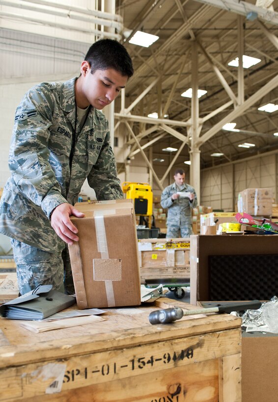 Airman 1st Class Kristopher Esparza, 28th Logistics Readiness Squadron aircraft parts store technician, separates boxes for storage at Ellsworth Air Force Base, S.D., May 9, 2012. The boxes are distributed into deployment kits and stored until requested by maintenance. (U.S. Air Force photo by Airman 1st Class Alystria Maurer/Released)