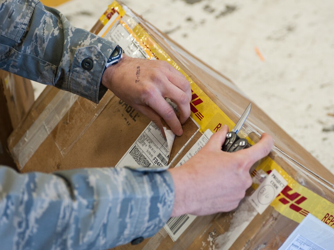 Airman 1st Class Derek Interrante, 28th Logistics Readiness Squadron aircraft parts store technician, removes shipping labels from packages during box maintenance at Ellsworth Air Force Base, S.D., May 9, 2012. All stickers and labels must be removed to avoid confusion when searching for a part in the aircraft parts store. (U.S. Air Force photo by Airman 1st Class Alystria Maurer/Released)