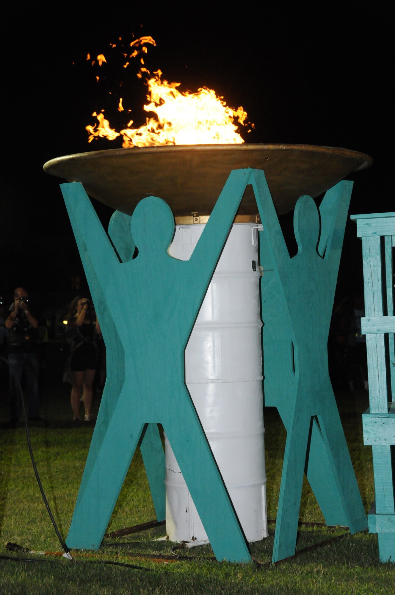 The caldron stands lit during the opening ceremonies of the Special Olympics Mississippi Summer Games, May 11, 2012, at Keesler Air Force Base, Miss. It’s the 26th year that Keesler has hosted the statewide event. Opening ceremonies took place May 11. Athletic competitions took place throughout the day and were followed by a victory dance May 12. More than 1,200 athletes and coaches and 3,000 volunteers joined forces to make the event a success.  (U.S. Air Force photo by Kemberly Groue)