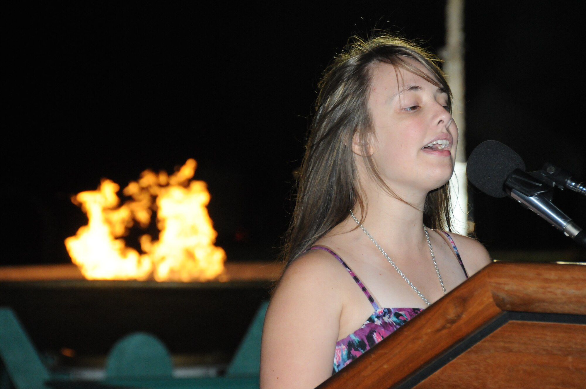 Heather Boyte, an athlete from Clinton, Miss., sings during the opening ceremonies of the Special Olympics Mississippi Summer Games, May 11, 2012, at Keesler Air Force Base, Miss. It’s the 26th year that Keesler has hosted the statewide event.  Athletic competitions took place throughout the day and were followed by a victory dance May 12. More than 1,200 athletes and coaches and 3,000 volunteers joined forces to make the event a success.  (U.S. Air Force photo by Kemberly Groue)