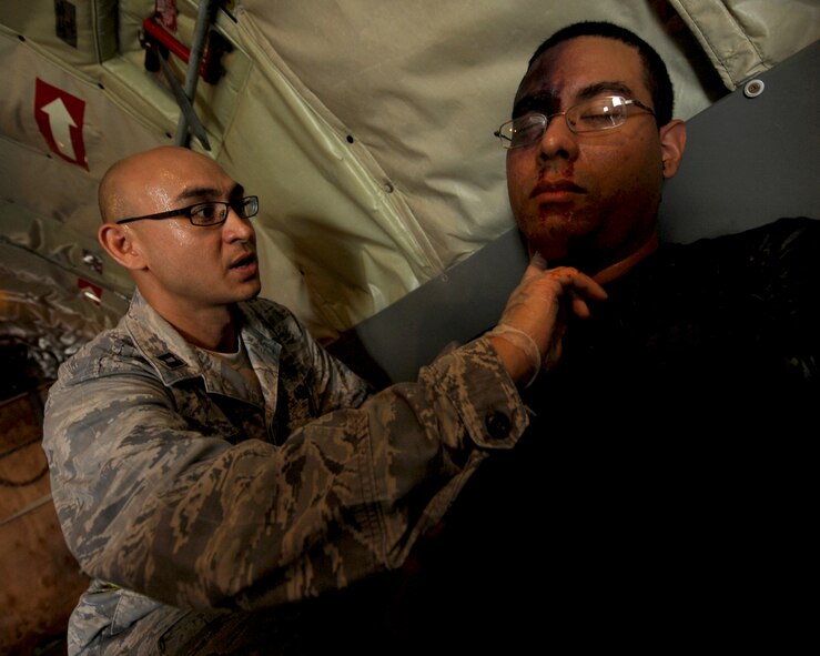 U.S. Air Force Capt. Rodney Ho, 18th Medical Group, checks the pulse of a simulated casualty during an emergency management exercise (EME) taking place during local operational readiness exercise Beverly High 12-4 on Kadena Air Base, Japan, May 16, 2012. Evaluations like this EME will be taking place all week to test the skills and knowledge of Kadena’s Airmen to ensure they are ready to respond to contingencies throughout the Pacific command. (U.S Air Force photo/Staff Sgt. Laszlo Babocsi)