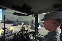 MINOT AIR FORCE BASE, N.D. -- Airman 1st Class Luke Wilson, 5th Civil Engineer Squadron heavy equipment operator, drives a loader during a routine road fixture project here May 10. Heavy equipment operators respond to infrastructure emergencies on base, clear roadways, ensure the airfield is clear of debris and holes and keep perimeter roads smooth. (U.S. Air Force photo/Senior Airman Brittany Y. Auld)