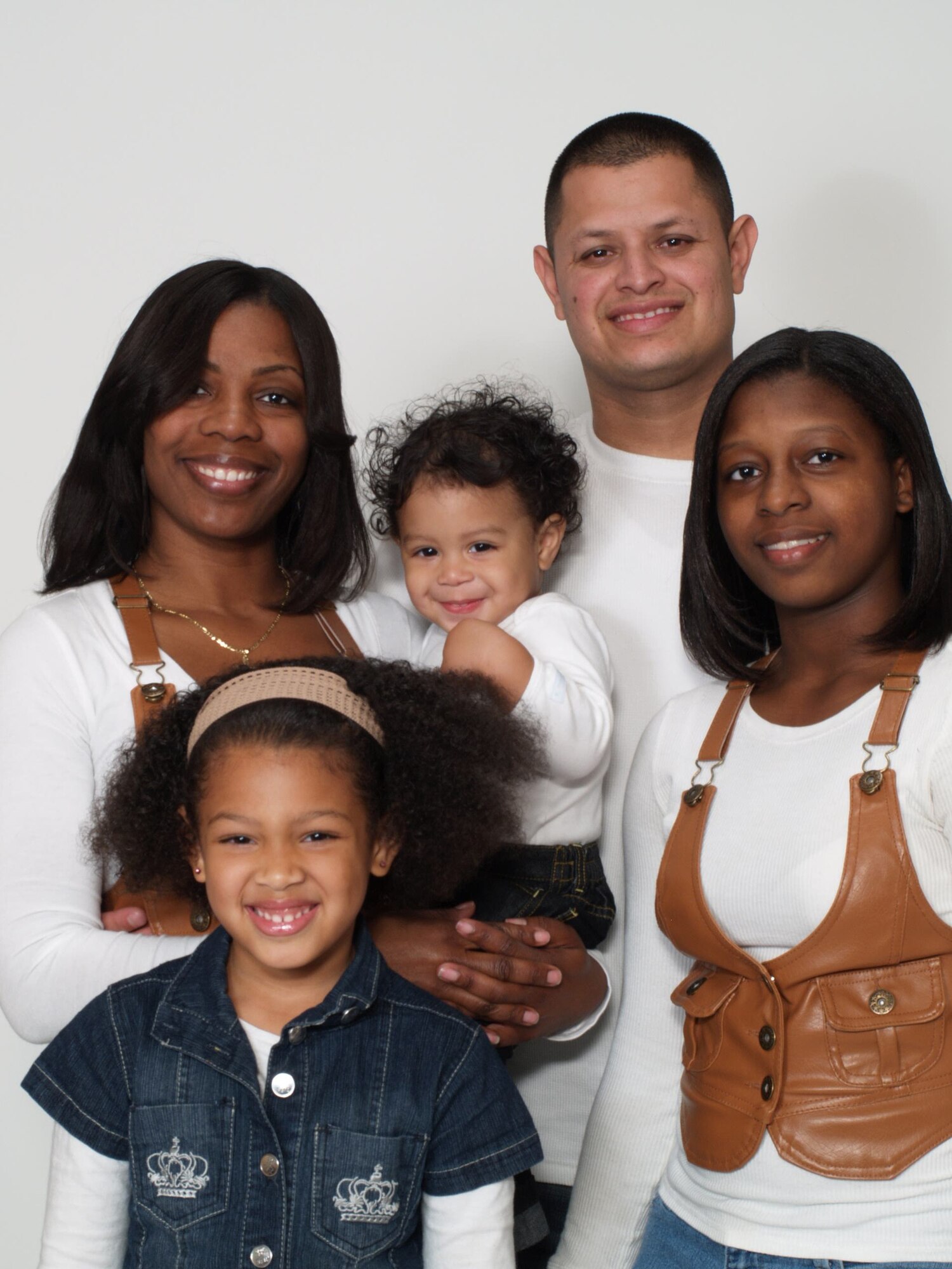 U.S. Air Force Tech. Sgt. Patricia Bustamante, 20th Maintenance Operations Squadron NCOIC of training management and instructional systems design, poses for a family photograph, Shaw Air Force Base, S.C., May 15, 2012. Bustamante is the Shaw Spotlight for the week of May 14 through 18. (U.S. Air Force photo by Airman 1st Class Ashley L. Gardner/ Released)