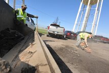 MINOT AIR FORCE BASE, N.D. -- Airman 1st Class Cody Waymire, 5th Civil Engineer Squadron heavy equipment operator, uses a K-12 concrete saw to cut around the damaged concrete during a routine road fixture project here May 10. Heavy equipment operators respond to infrastructure emergencies on base. They clear roadways, ensure the airfield is clear of debris and holes, keep perimeter roads smooth. (U.S. Air Force photo/Senior Airman Brittany Y. Auld)