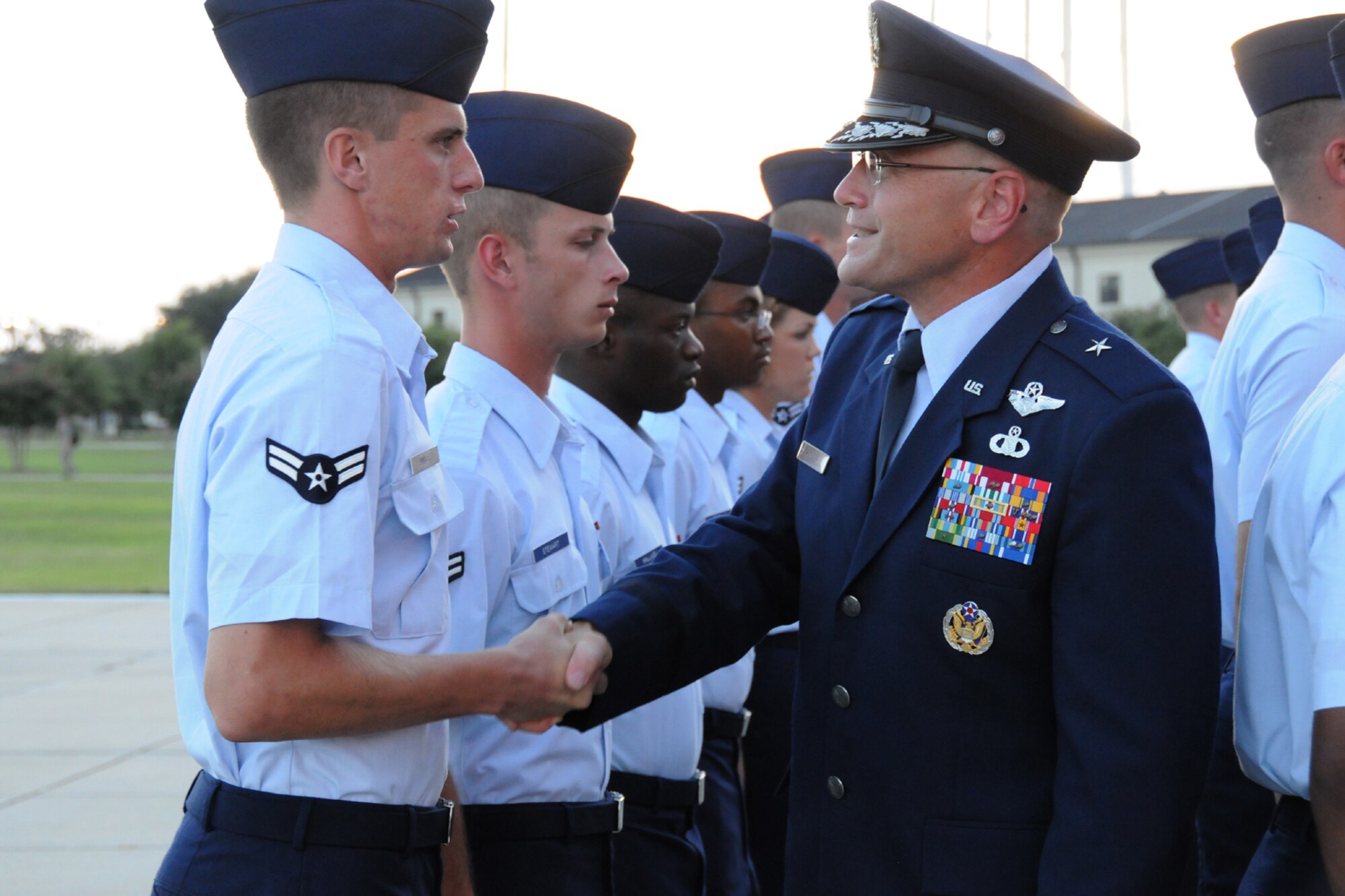 Brig. Gen. Andrew Mueller, 81st Training Wing commander, greets students during his change of command ceremony in 2010. He relinquishes command to Brig. Gen. Brad Spacy 8 a.m. May 18, 2012, at the parade field behind the Levitow Training Support Facility, Keesler Air Force Base, Miss.  (U.S. Air Force photo by Kemberly Groue)