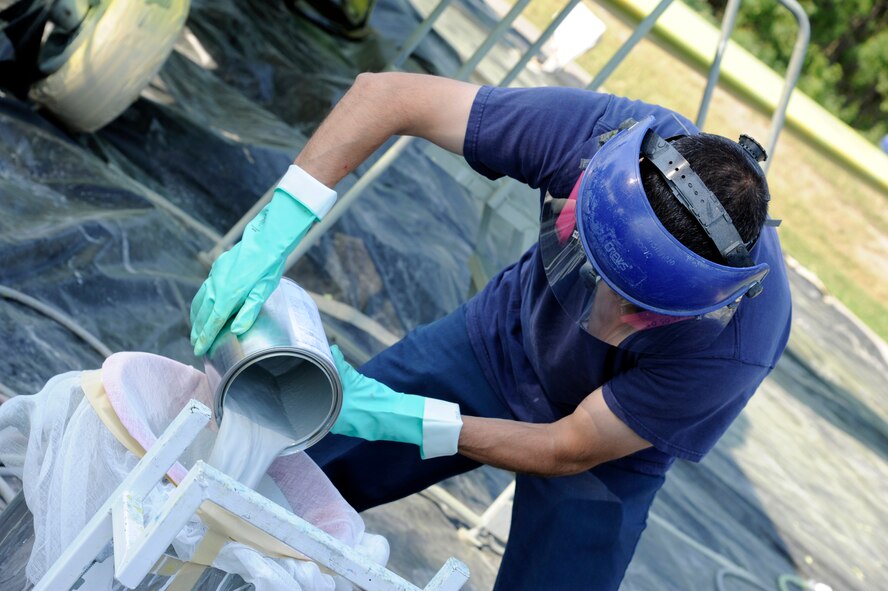 An aircraft painter from the 47th Maintenance Directorate’s Corrosion Control section pours paint into the spray gun’s canister before painting the T-33 Shooting Star jet trainer on display at Laughlin Air Force Base, Texas, May 6, 2012. The corrosion control section sets aside a month each year to clean and repair the 11 static aircraft that populate Laughlin’s landscape. (U.S. Air Force photo/Airman 1st Class Nathan Maysonet)