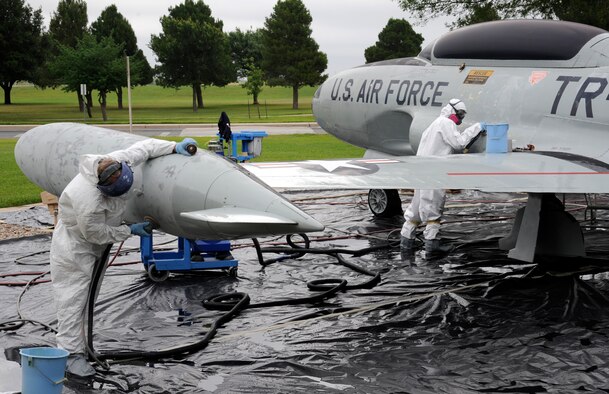 Maintainers from the 47th Maintenance Directorate’s Corrosion Control section begin to strip the paint from a T-33 Shooting Star jet trainer on display before applying primer at Laughlin Air Force Base, Texas, May 1, 2012. The corrosion control section sets aside a month each year to clean and repair the 11 static aircraft that populate Laughlin’s landscape. (U.S. Air Force photo/Airman 1st Class Nathan Maysonet)