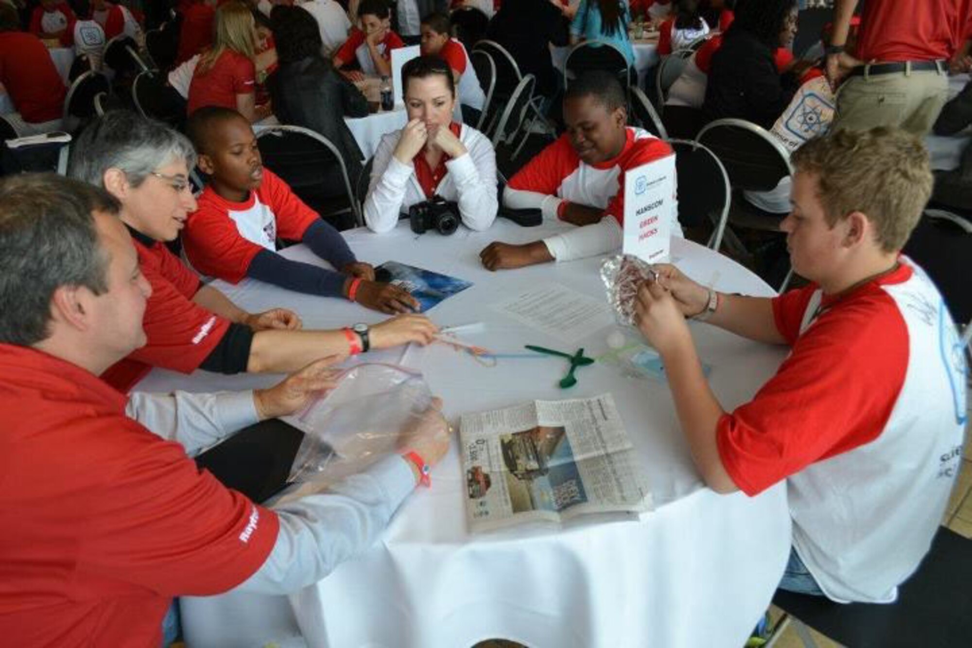 FOXBOROUGH, Mass. – (from left to right) Charles Miller, Pamela Winters, Samuel Baker, Aleah Davis, Patrick Baker and Bain Kitchin work to create a device that drops golf balls into various size tubes from 14 inches away during a challenge at the Science of Sports Science Fair May 6 at Gillette Stadium. The team from Hanscom won the challenge and will have an opportunity to attend a New England Patriots training camp session. (Courtesy photo)