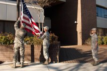 HANSCOM AIR FORCE BASE, Mass. – Col. Stacy L. Yike, 66th Air Base Group commander, salutes during Retreat as Airmen prepare to remove the flag and present it to her. Yike will retire after more than 20 years of service. (U.S. Air Force photo by Linda LaBonte Britt)