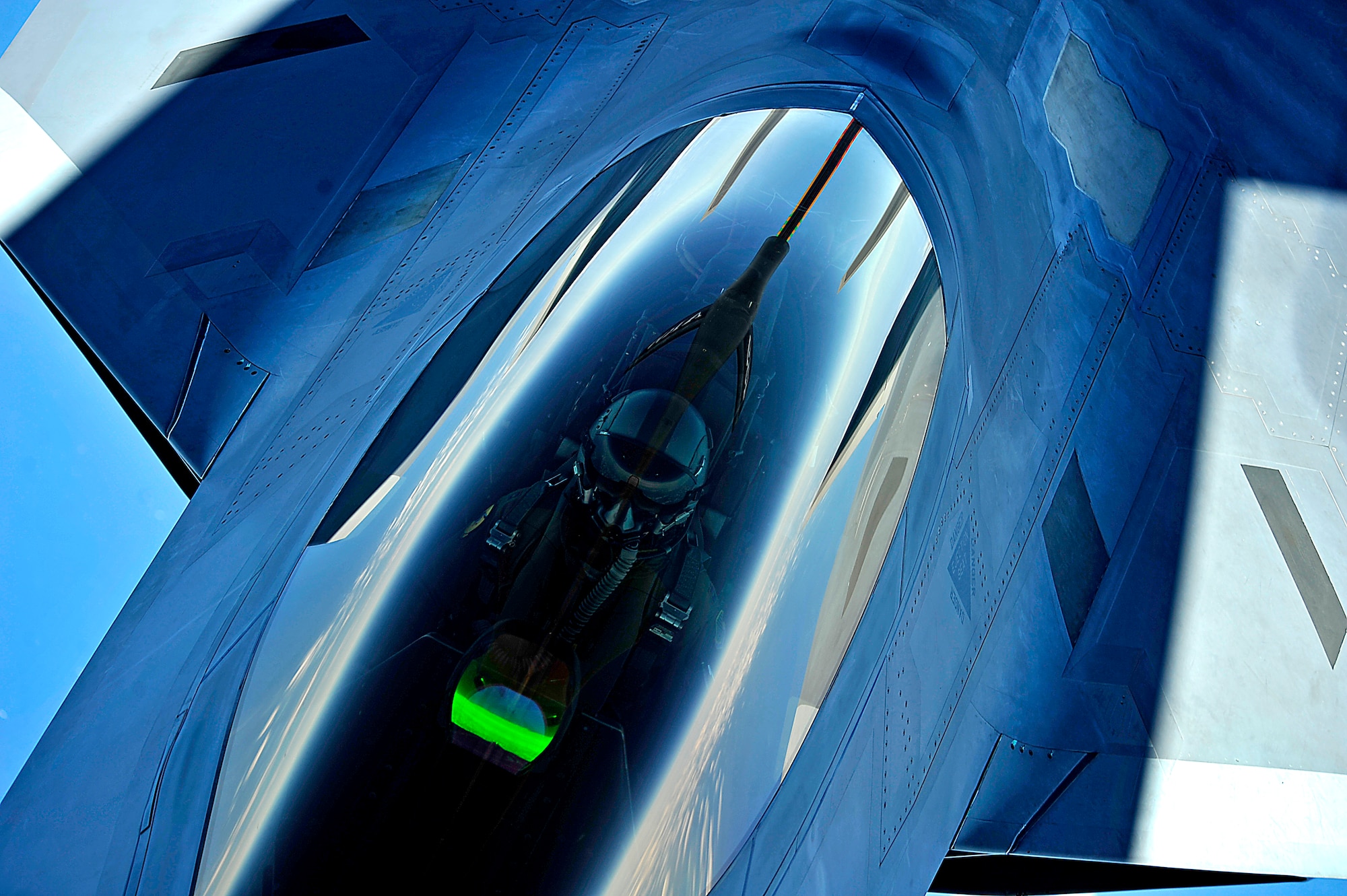 A KC-135 Stratotanker with the 756th Air Refueling Squadron, Joint Base Andrews Naval Air Facility, Md. refuels a 1st Fighter Wing's F-22 Raptor from Joint Base Langley-Eustis, Va. off the east coast on May 10, 2012. The first Raptor assigned to the Wing arrived Jan. 7, 2005. This aircraft was allocated as a trainer, and was docked in a hanger for maintenance personnel to familiarize themselves with its complex systems. The second Raptor, designated for flying operations, arrived Jan. 18, 2005. On Dec. 15, 2005, Air Combat Command commander, along with the 1 FW commander, announced the 27th Fighter Squadron as fully operational capable to fly, fight and win with the F-22. (U.S. Air Force Photo by: Master Sgt. Jeremy Lock) (Released)
