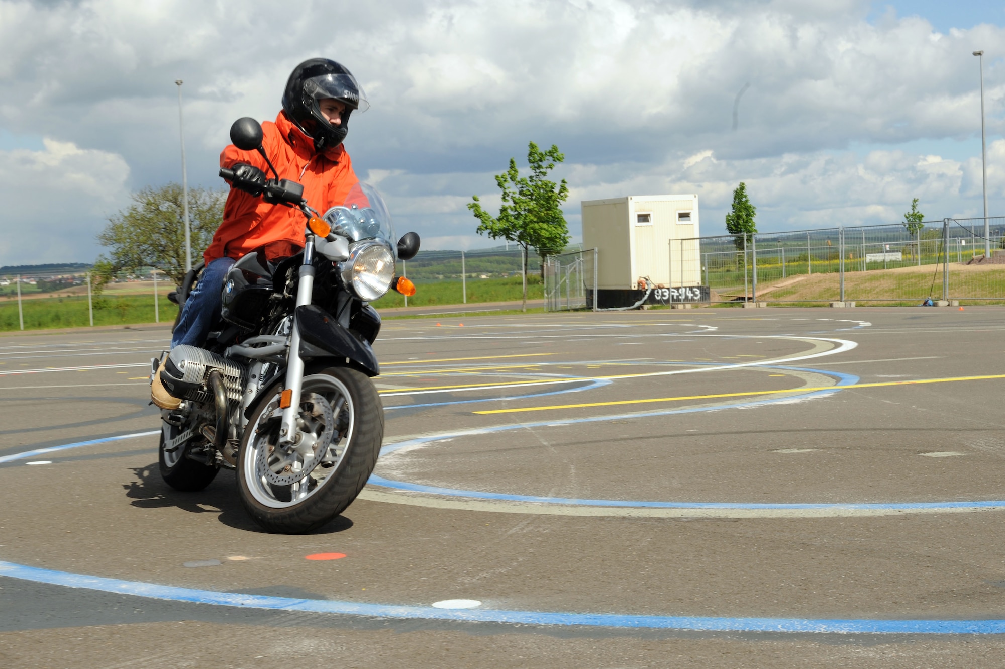 SPANGDAHLEM AIR BASE, Germany – Maj. Erik Olsen, 52nd Operations Support Squadron, maneuvers his motorcycle around a turn during a motorcycle safety class at the Saber driving course here May 15. The course participants practiced maneuvers to include path of travel, quick stops and obstacle avoidance. The class is geared to improve riders’ skill by performing different maneuvers on the course as well as discussing and reviewing a variety of safety information. The 52nd Fighter Wing Safety office conducts the motorcycle safety course three times monthly. U.S Air Forces in Europe regulations mandate that every motorcyclist on base must take or retake this class once every three years to keep their skillset current. (U.S. Air Force photo by Senior Airman Christopher Toon/Released)