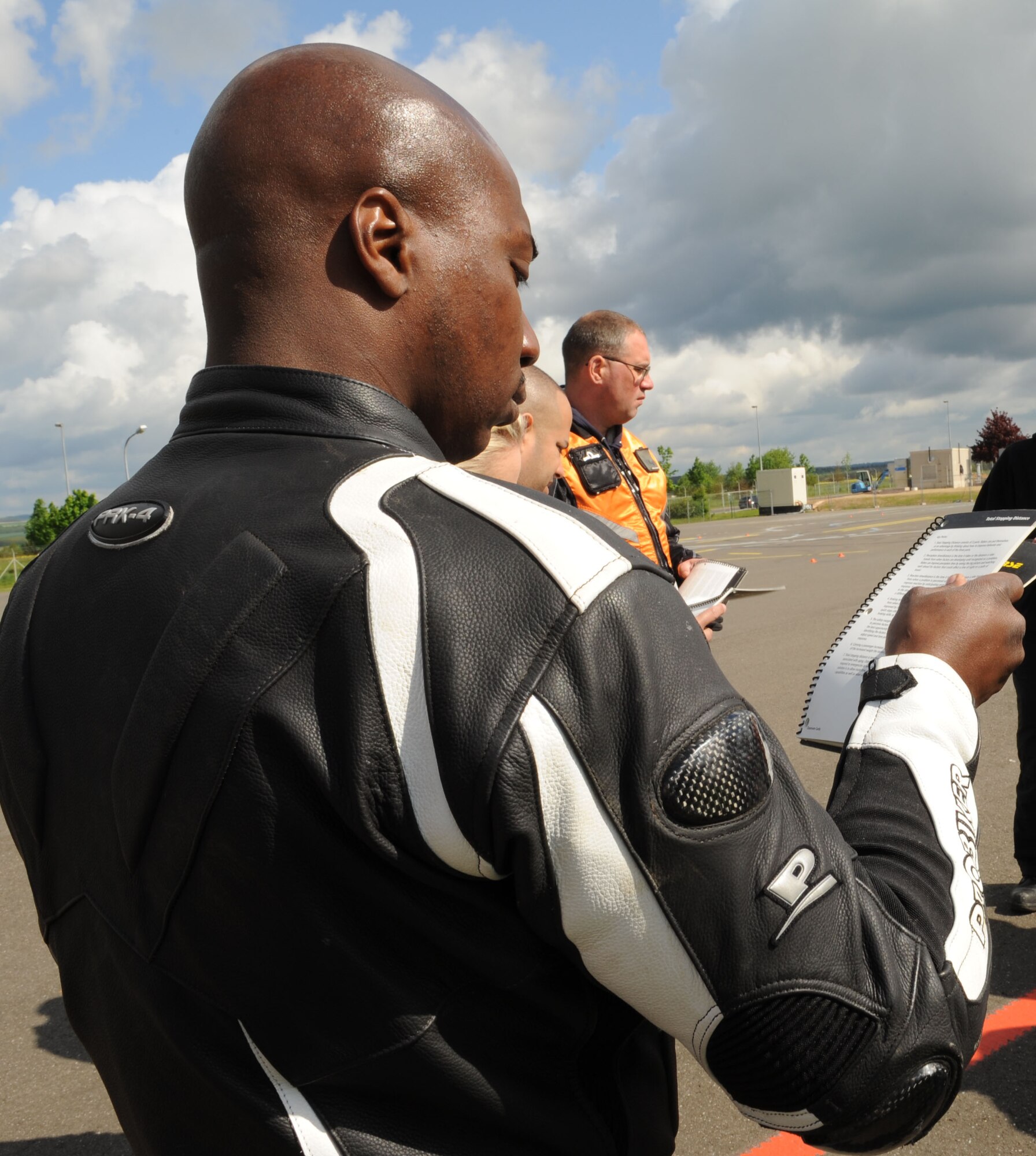 SPANGDAHLEM AIR BASE, Germany – Tech. Sgt. Anthony Toliver, 52nd Aircraft Maintenance Squadron, reviews safety material during the motorcycle safety class at the Saber driving course here May 15. The class is geared to improve riders’ skill by performing different maneuvers on the course as well as discussing and reviewing a variety of safety information. The 52nd Fighter Wing Safety office conducts the motorcycle safety course three times monthly. U.S Air Forces in Europe regulations mandate that every motorcyclist on base must take or retake this class once every three years to keep their skillset current. (U.S. Air Force photo by Senior Airman Christopher Toon/Released)