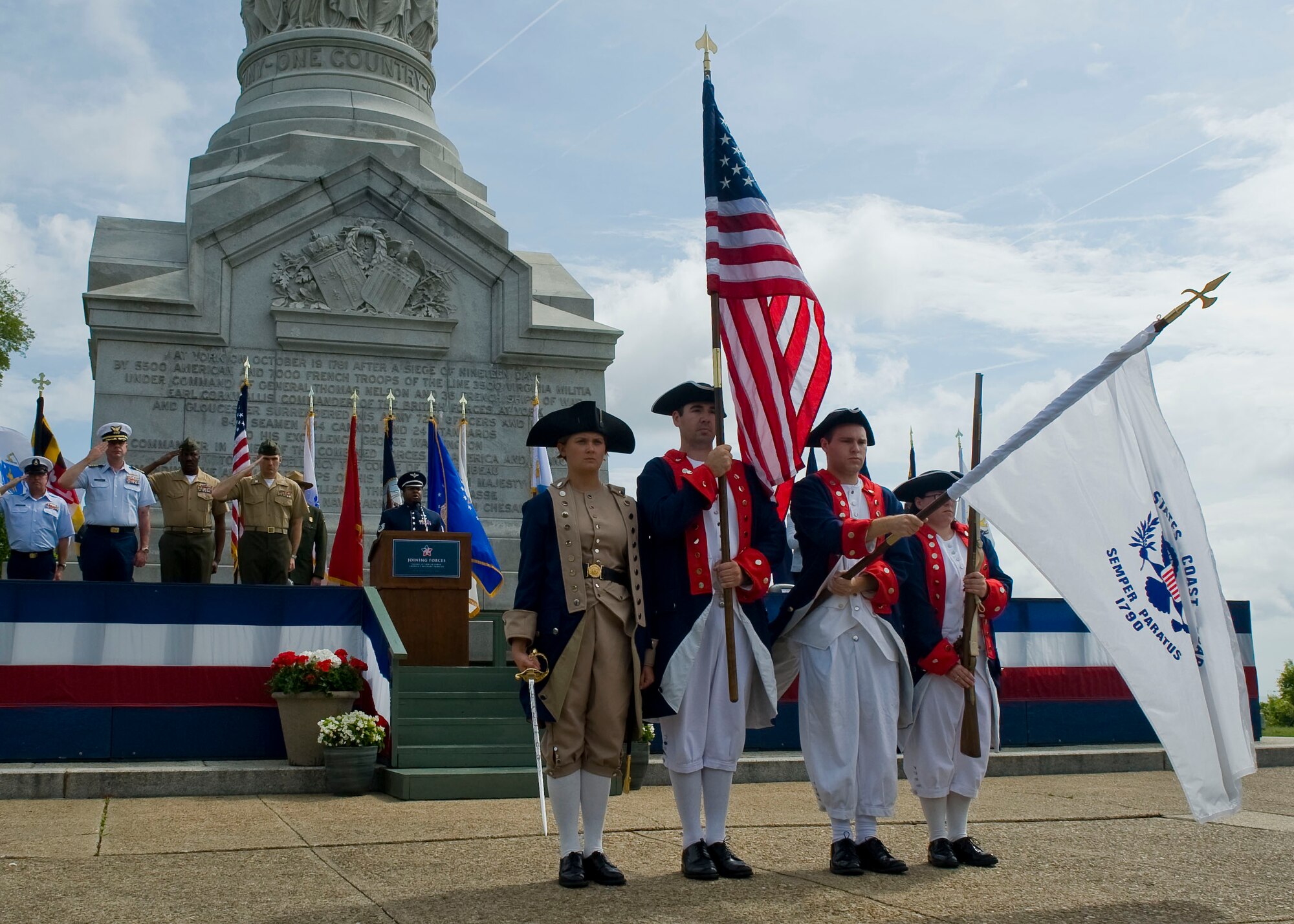 The U.S. Coast Guard’s 1790 Color Guard from Training Center Yorktown presents the Colors as U.S. Air Force Tech. Sgt. Niko Ellison of the Air Force Heritage of America Band sings the National Anthem during the Joining Forces’ Honoring Members and Families event May 15, 2012 at the Colonial National Historical Park in Yorktown, Va. The America the Beautiful National Parks and Federal Recreation Lands Annual Pass is accepted at National Park Service, U.S. Fish and Wildlife Service, Bureau of Reclamation, Bureau of Land Management, U.S. Forest Service and U.S. Army Corps. sites that charge entrance or standard amenity fees. (U.S. Air Force photo by Senior Airman John D. Strong II/Released)