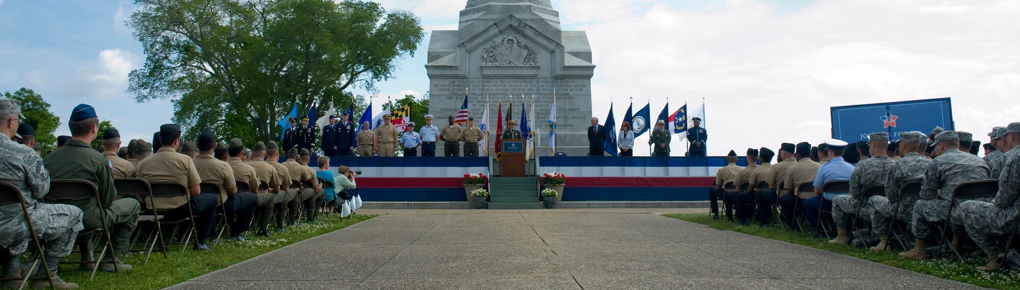 Jon Jarvis, the U.S. National Park Service director, opens the Joining Forces’ Honoring Members and Families event May 15, 2012 at the Yorktown Victory Monument at Colonial National Historical Park in Yorktown, Va.  Beginning May 19, which is Armed Forces Day, active-duty service members can obtain the new America the Beautiful National Parks and Federal Recreation Lands Annual Pass for free. (U.S. Air Force photo by Senior Airman John D. Strong II/Released)