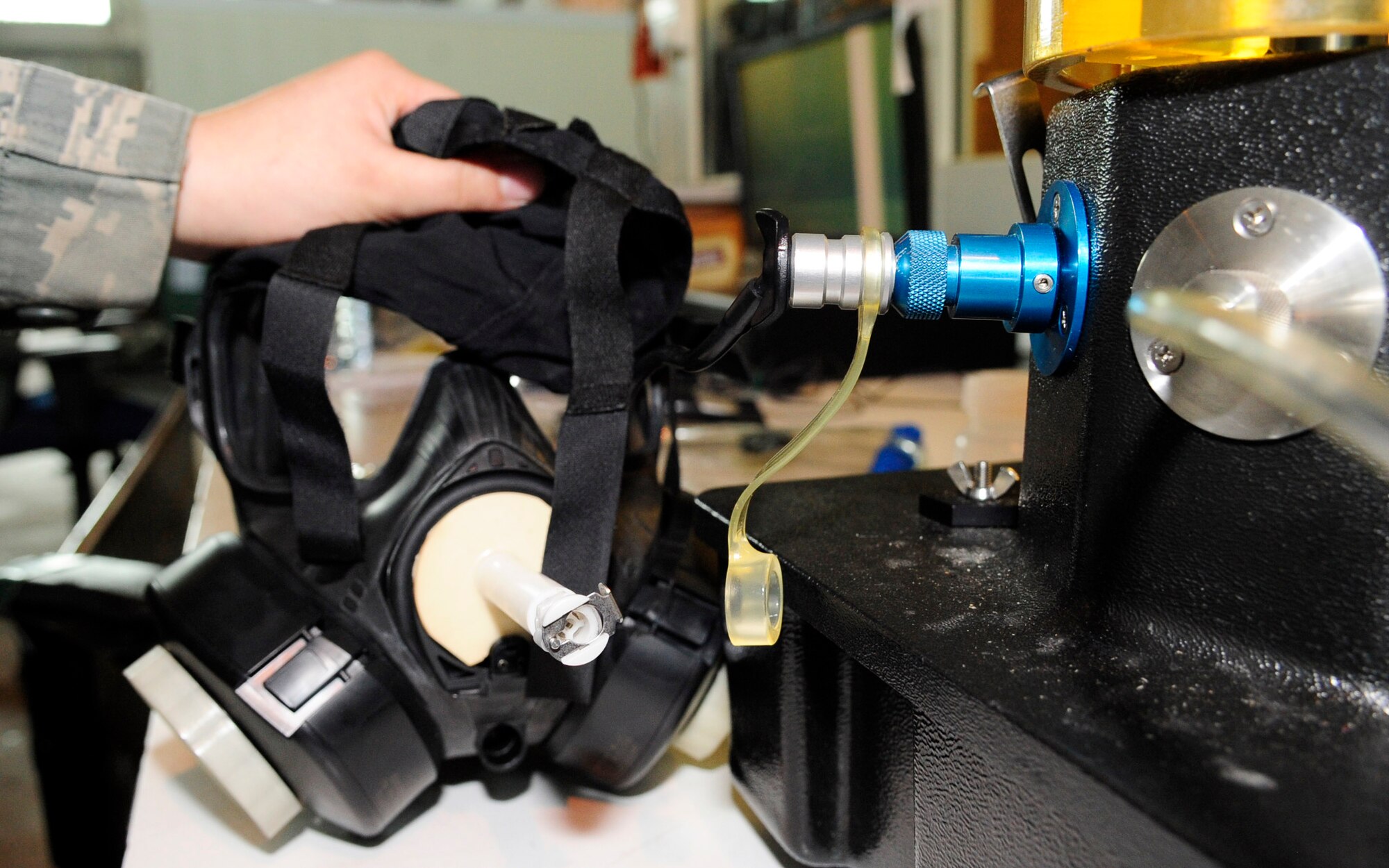 RAF MILDENHALL, England – Airman 1st Class Lisa Foti, 100th Logistics Readiness Squadron individual protective equipment journeyman, performs a drink tube inspection on an M50 gas mask here May 15, 2012. Regular quality checks are performed on gas masks to ensure they are in proper working order and able to protect Airmen if needed. (U.S. Air Force photo/Senior Airman Ethan Morgan)