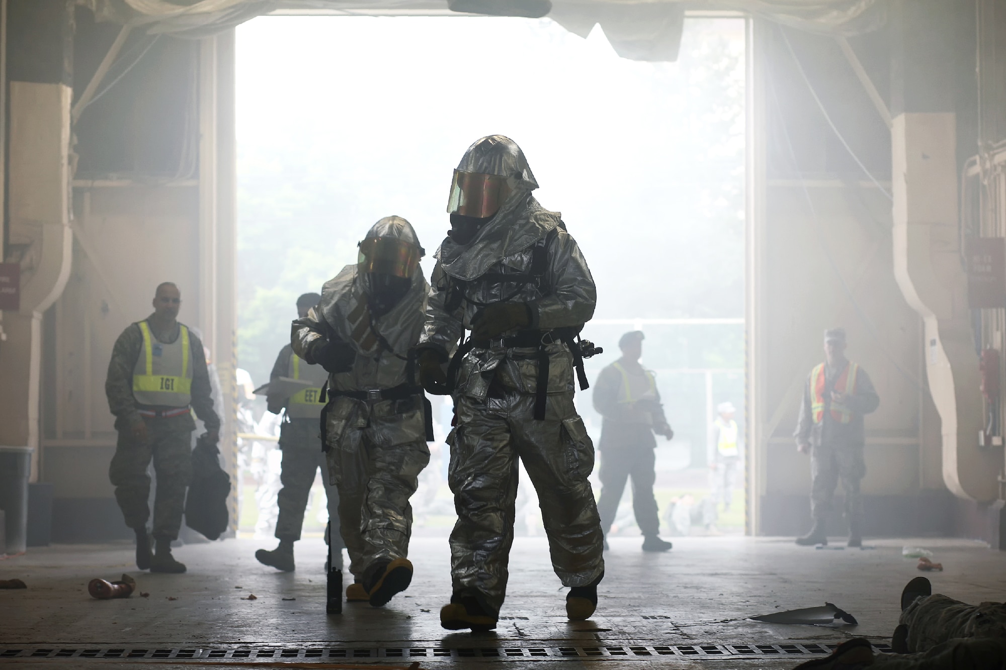YOKOTA AIR BASE, Japan -- Yokota firefighters arrive on scene and battle a simulated fire during the Emergency Management Exercise portion of the Consolidated Unit Inspection at Yokota Air Base, Japan, May 15, 2012. Firefighters arrived on scene moments after reports of a simulated fire broke out in Hanger 1503. (U.S. Air Force photo by Osakabe Yasuo)  