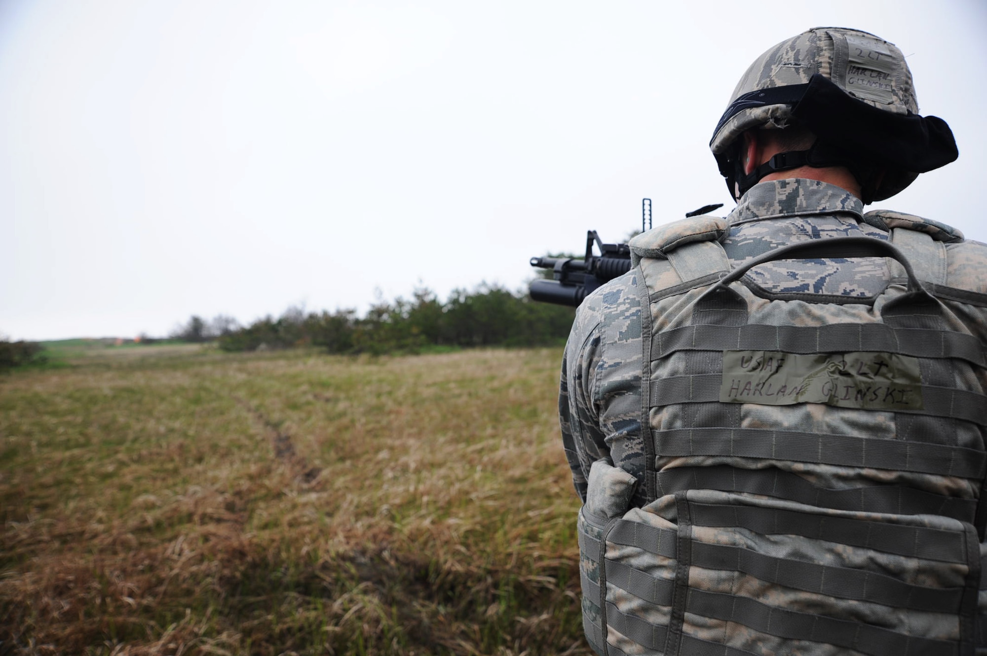 U.S. Air Force 2nd Lt. Harlan Glinski, 35th Security Forces Squadron logistics and resources officer, fires a 40mm practice round from a M203 grenade launcher during qualification training at Draughon Range, Japan, May 16, 2012. In order for SFS Airmen to qualify, they must fire off 15 rounds and manage at least three successful hits on their target. (U.S. Air Force photo by Airman Kenna Jackson/Released)