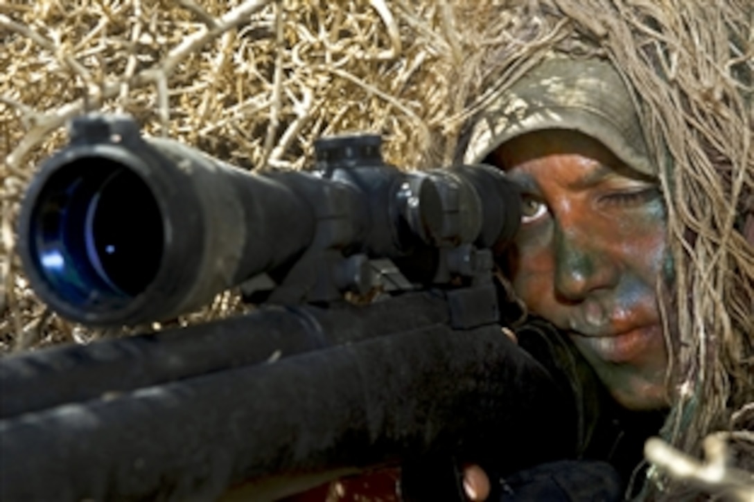 U.S. Air Force Staff Sgt. Alyssa Gomez peers down the scope of her M24 Sniper Weapon System at the Nevada Test and Training Range on Nellis Air Force Base, Nv., May 11, 2012. Gomez, a sniper assigned to the 99th Ground Combat Training Squadron, is the ninth female in Air Force history to become a sniper after graduating from a 19-day sniper course on Fort Bliss, Texas.