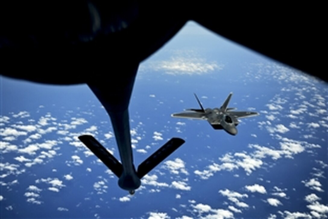 An Air Force F-22 Raptor pulls into position to accept fuel from a KC-135 Stratotanker off the East Coast, May 10, 2012. The F-22 is assigned to the 1st Fighter Wing on Joint Base Langley-Eustis, Va., and the Stratotanker is assigned to the 756th Air Refueling Squadron on Joint Base Andrews Naval Air Facility, Md.