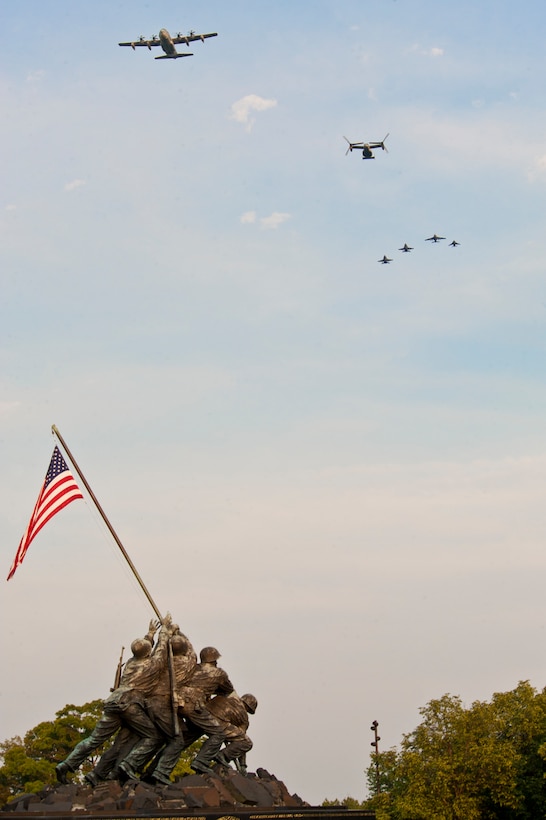 A flight of the various Marine Corps aircraft flies over the Marine Corps War Memorial during the Marine Aviation Centennial Parade, which celebrated 100 years of Marine aviation, at Arlington, Va., May 16.