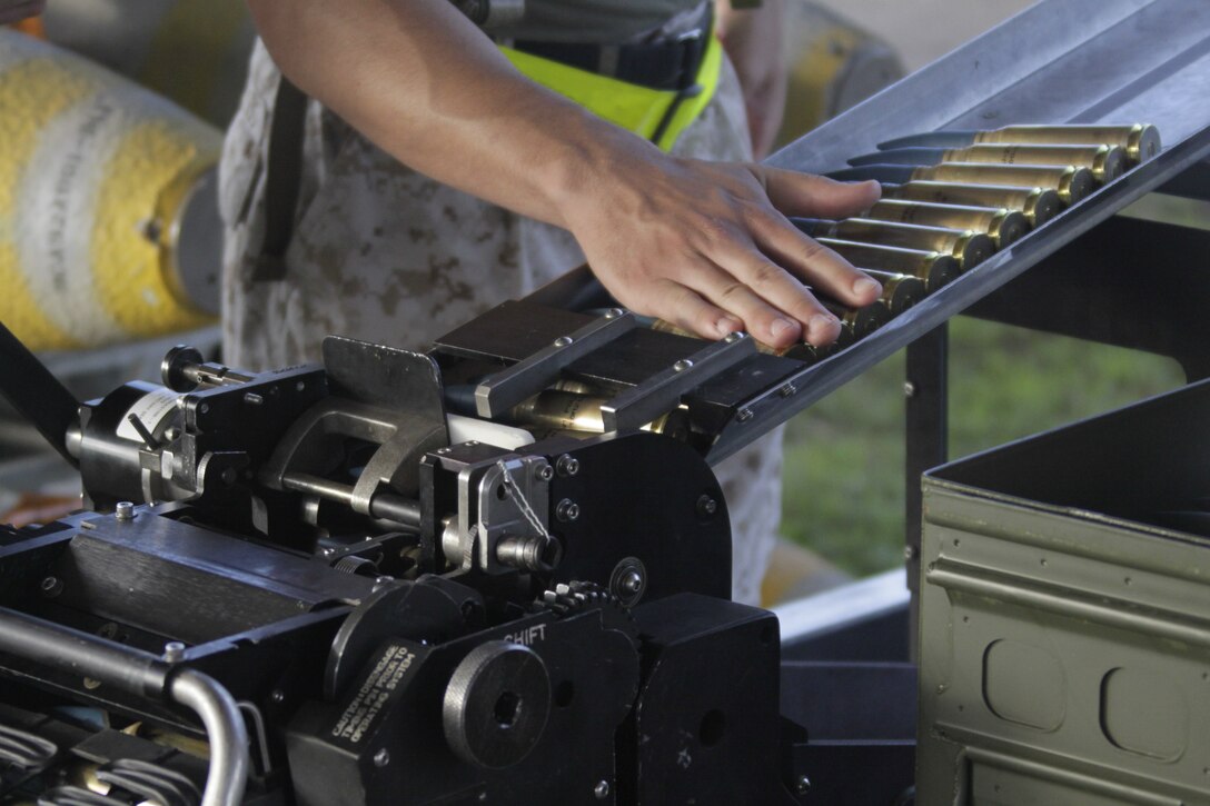 A Marine funnels inert munitions for use by aircraft during Exercise Geiger Fury 2012, here May 17. Marine Aircraft Logistics Squadron 12 ordnance Marines supply ordnance to Marine All-Weather Fighter Attack Squadron 242, Marine All-Weather Fighter Attack Squadron 121 and Marine Fighter Attack Squadron 232.