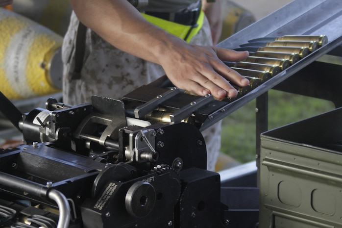 A Marine funnels inert munitions for use by aircraft during Exercise Geiger Fury 2012, here May 17. Marine Aircraft Logistics Squadron 12 ordnance Marines supply ordnance to Marine All-Weather Fighter Attack Squadron 242, Marine All-Weather Fighter Attack Squadron 121 and Marine Fighter Attack Squadron 232.