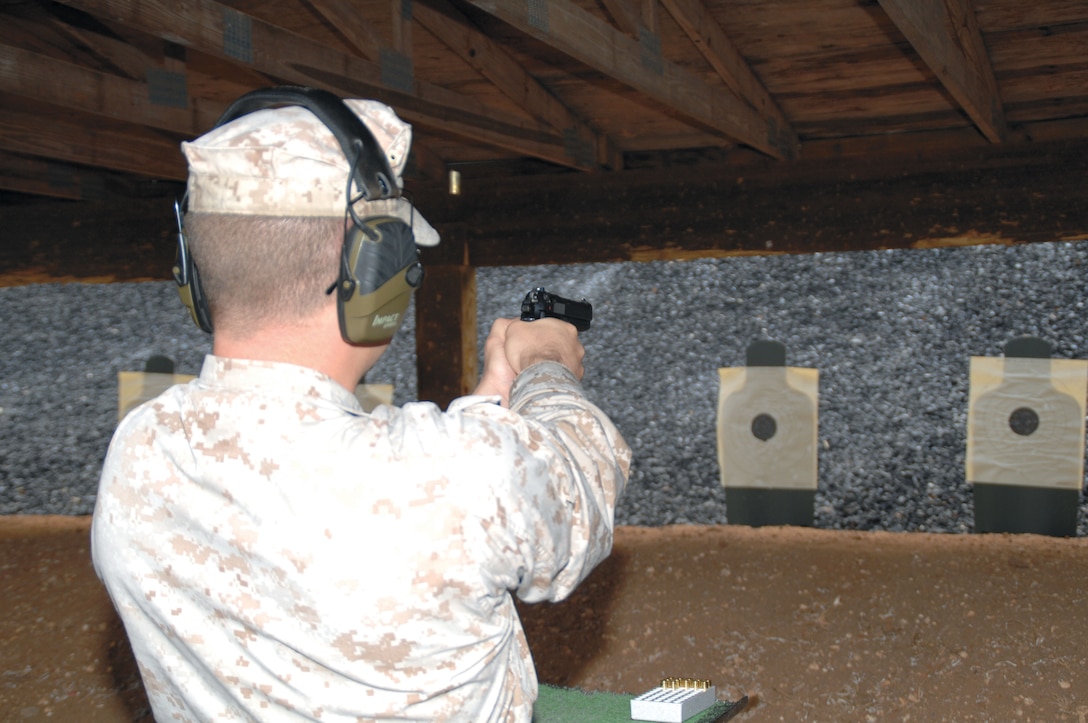 Staff Sgt. Matthew Maloy, Logistics Services Management Center tank equipment specialist, Marine Corps Logistics Command, fires a Beretta M9 pistol at Marine Corps Logistics Base Albany's Recreational Pistol Range, April 25, for his annual weapons qualification. He was among 25 Marines and four civilian police officers who fired at the newly-upgraded range.