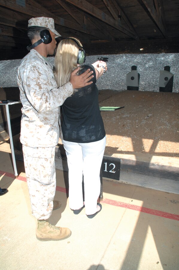 Sgt. Nicholas McMorris, range noncommissioned officer-in-charge, Marine Corps Logistics Base Albany, teaches a supplier how to shoot at the Recreational Pistol Range during the second annual Key Wholesale Supplier Day here, April 25-27. The three-day event allowed participants to become familiar with the Marine Corps and MCLC's mission in support of the warfighter.