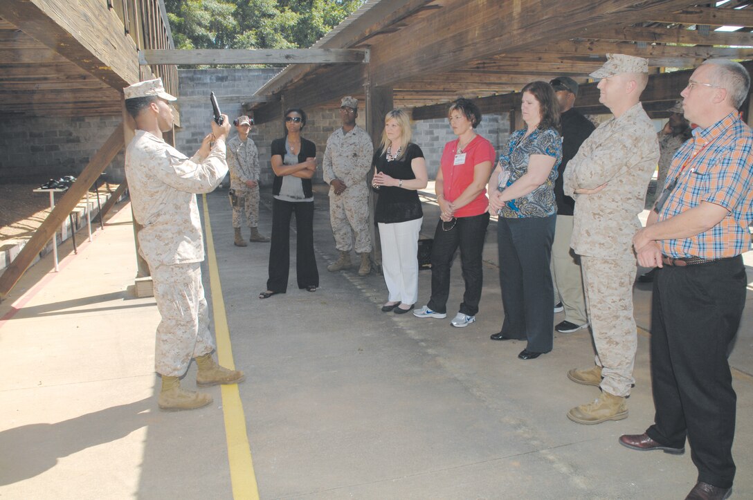 Suppliers learn pistol safety before firing on the Recreational Pistol Range during the second annual Key Wholesale Supplier Day here, April 25-27.
