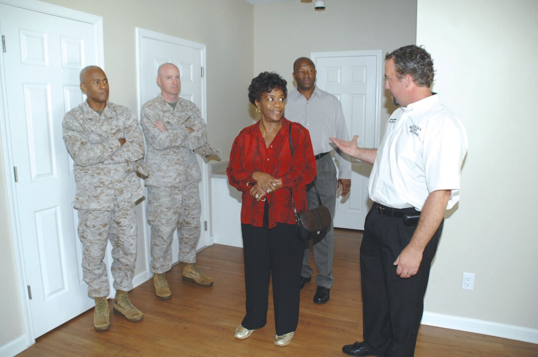 Mayor Dorothy Hubbard, City of Albany, tours one of the vacant homes in Hill Village with Marine Corps Logistics Base Albany officials during her visit here, May 7.