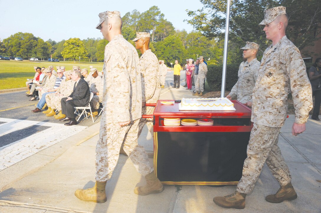 Marines with Marine Corps Logistics Command roll out a birthday cake during MCLC's ninth anniversary celebration May 8 in front of Building 3700. Marine Corps Materiel Command and Marine Corps Logistics Bases consolidated into a single command to become MCLC, May 8, 2003.