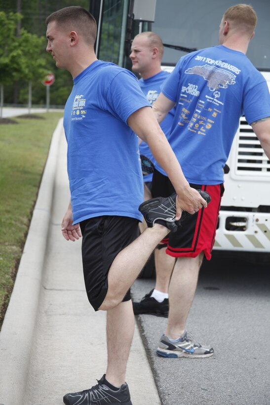 Marines with Marine Corps Air Station Cherry Point Provost Marshall's Office stretch out before participating in the 2012 Law Enforcement Torch Run in Havelock, N.C., May 17. The event allowed local law enforcement agencies to foster awareness and raise money for the North Carolina Special Olympics. "My unit has supported this event every year since 1987," said Cpl. Lucas L. Spann, a military policeman. "It feels good to carry on the tradition and support a worthwhile cause."