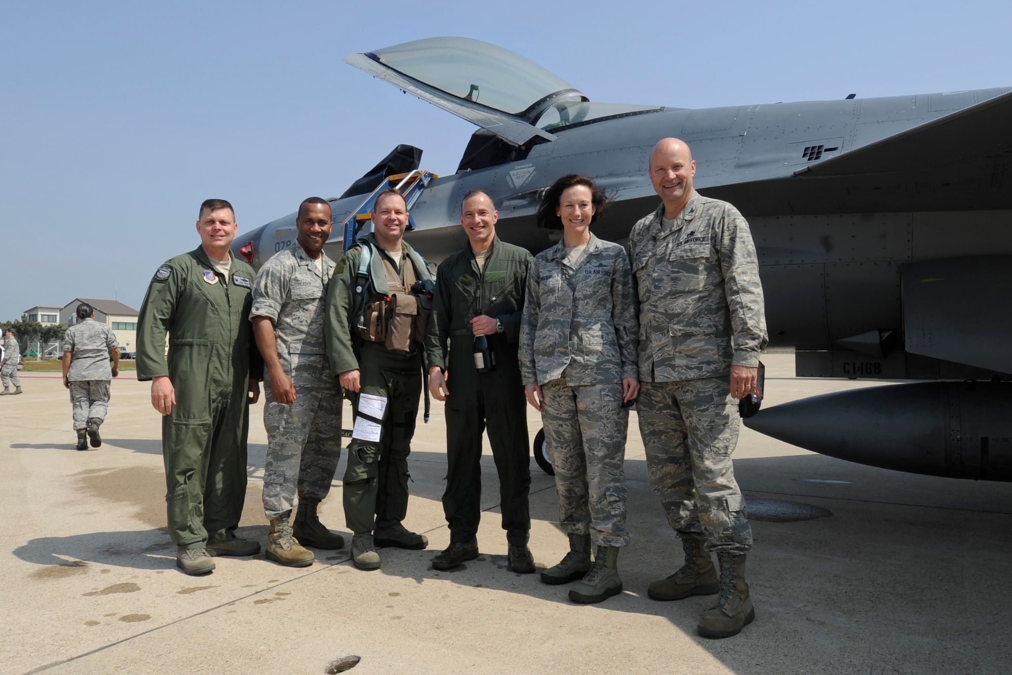 From left, Col. Craig Leavitt, 8th Operation Group commander, Col. Alvis Headen, 8th Medical Group commander, Col. Stephen Williams, 8th Fighter Wing vice commander, Col. Scott L. Pleus, 8th FW commander, Col. Suzanne Kumashiro, 8th Mission Support commander, and Col. Dane West, 8th Maintenance Group commander, pose together after Plues’ final flight as the wing commander of the Wolf Pack on Kunsan Air Base, Republic of Korea, May 16, 2012. (U.S. Air Force photo/Senior Airman Jessica Hines)