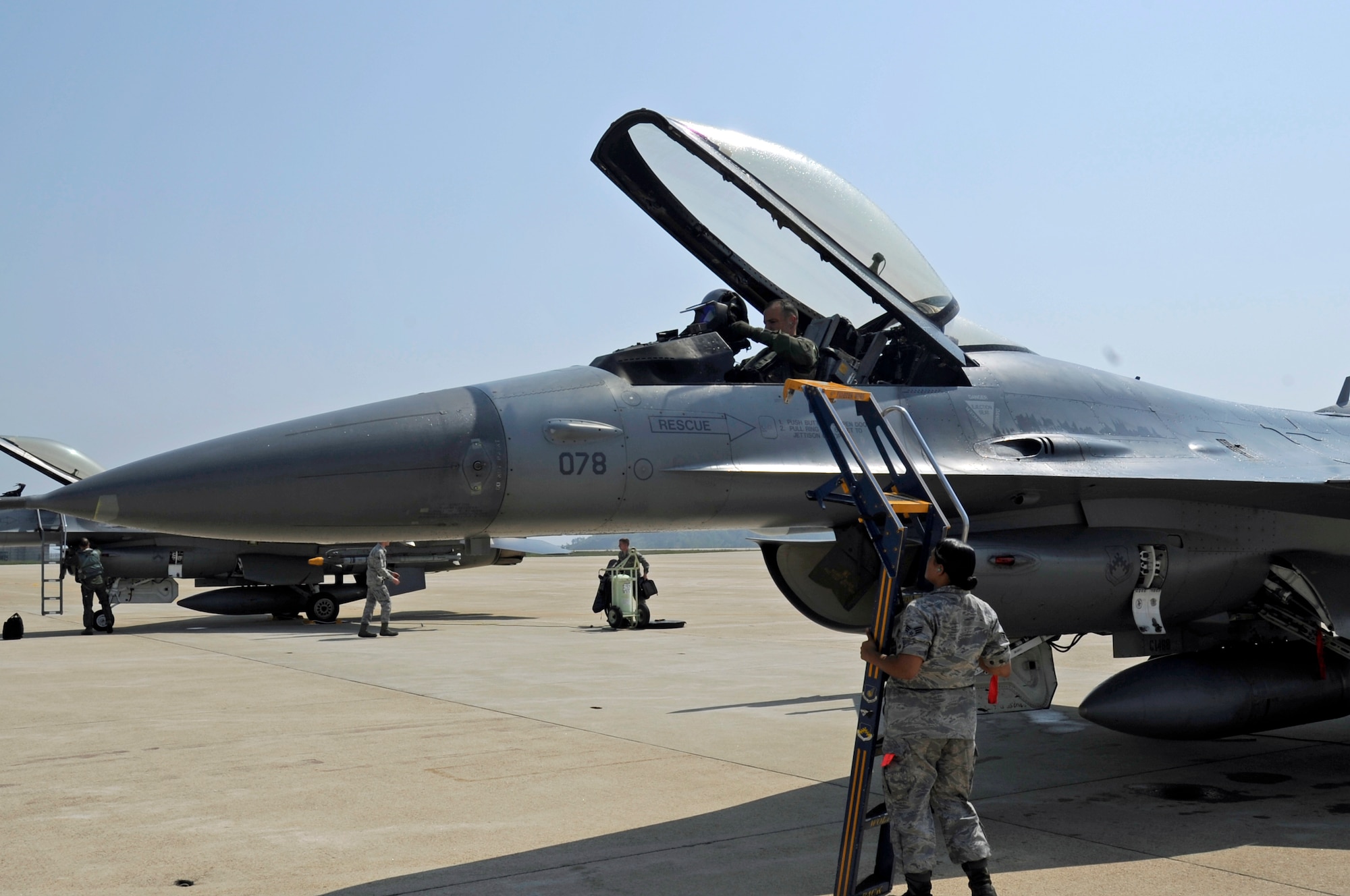Col. Scott L. Pleus, 8th Fighter Wing commander, prepares to exit his F-16 after his final flight as the wing commander of the Wolf Pack on Kunsan Air Base, Republic of Korea, May 16, 2012. (U.S. Air Force photo/Senior Airman Jessica Hines)