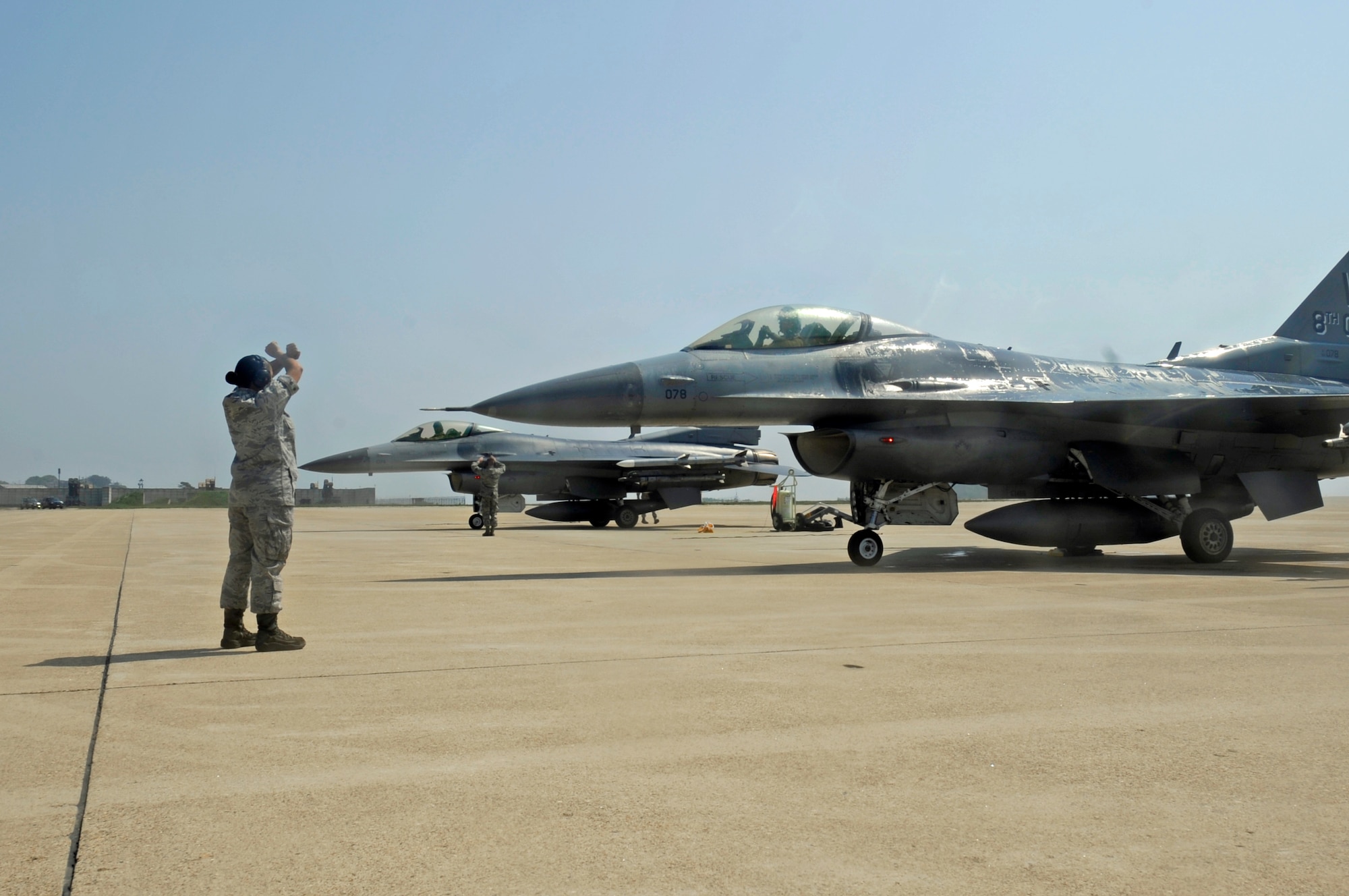 Col. Scott L. Pleus, 8th Fighter Wing commander, waits to exit his F-16 after his final flight as the wing commander of the Wolf Pack on Kunsan Air Base, Republic of Korea, May 16, 2012. (U.S. Air Force photo/Senior Airman Jessica Hines)