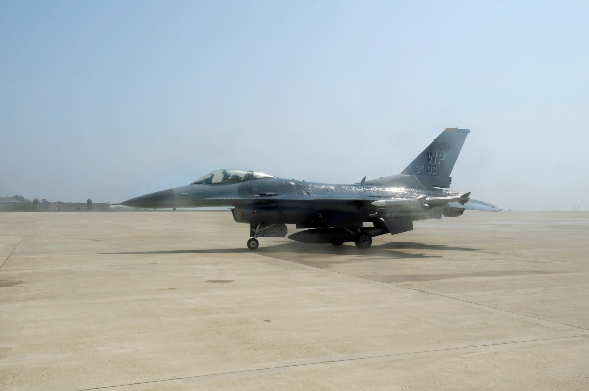 Col. Scott L. Pleus, 8th Fighter Wing commander, prepares to stop after his final flight as the wing commander of the Wolf Pack on Kunsan Air Base, Republic of Korea, May 16, 2012. The "fini" flight is an Air Force tradition that can be traced back to the Vietnam War when aircrews celebrated after completing 100 combat missions. (U.S. Air Force photo/Senior Airman Jessica Hines)