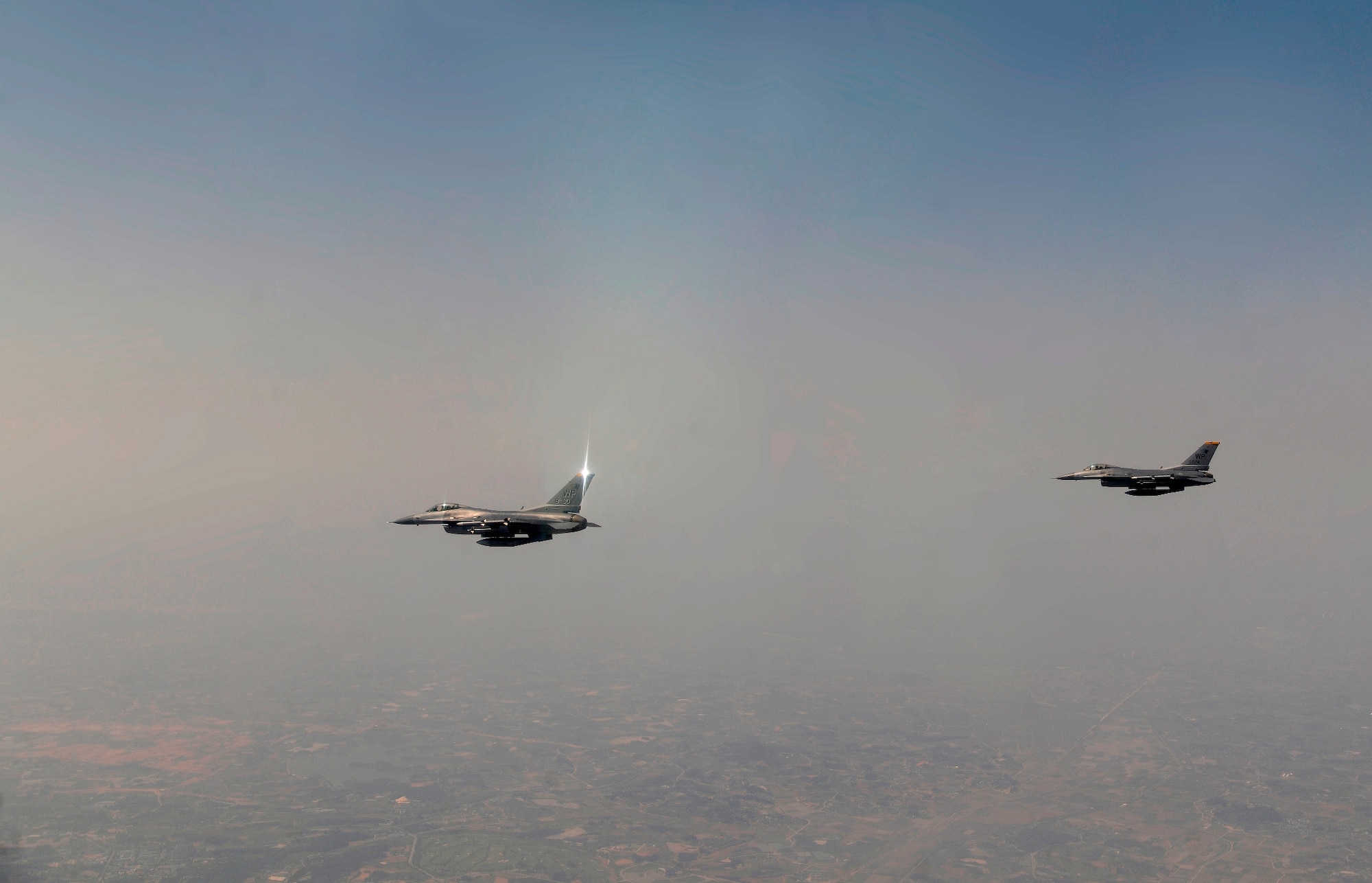 Col. Scott Pleus, 8th Fighter Wing commander, flies his final flight as the wing commander of the Wolf Pack with Col. Stephen C. Williams, 8th FW vice commander, in their F-16 Fighting Falcons at Kunsan Air Base, Republic of Korea, May 16, 2012. The fini-flight is a long standing practice of both the United States to commemorate a commander’s departure from an installation. (U.S. Air Force photo/Staff Sgt. Rasheen A. Douglas)