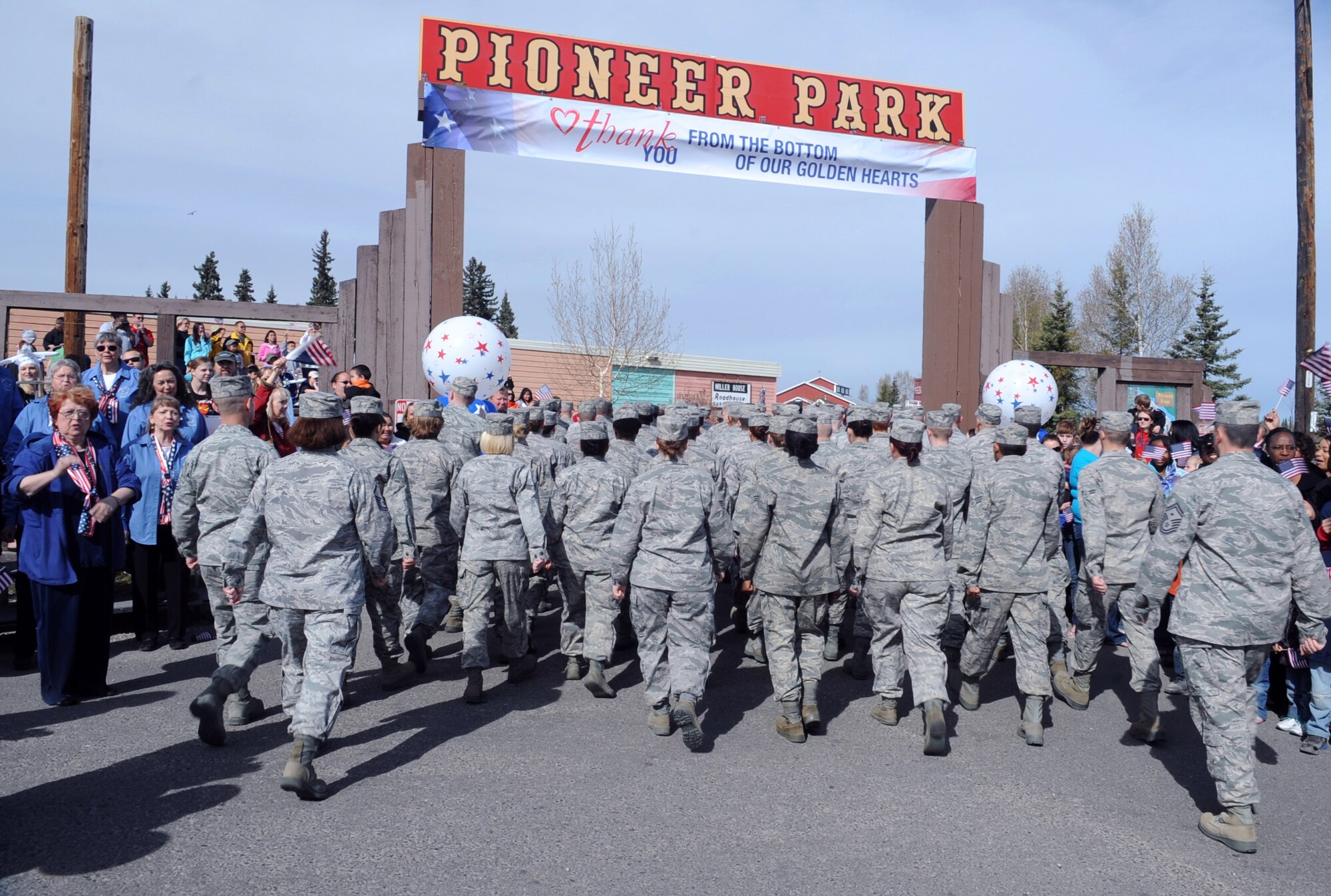 U.S. Air Force Airmen from the 354th Fighter Wing march into Pioneer Park during the Salute to Our Military Parade May 12, 2012, Fairbanks, Alaska. More than 5,000 active, guard, veteran and wounded members of the military marched a total of 3 miles from Fort Wainwright to Pioneer Park. (U.S. Air Force photo/Airman 1st Class Lauren-Taylor Garcia)
