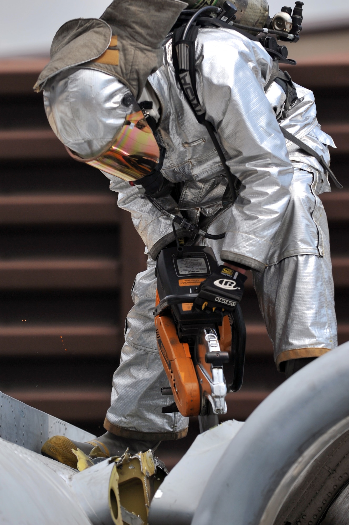 Senior Airman David Brady, 51st Civil Engineer Squadron firefighter, cuts a decommissioned A-10 Thunderbolt II into smaller pieces using a K-12 power saw at Osan Air Base, Republic of Korea, May 17, 2012. The jet was deemed as surplus after several years of being used as a training aircraft and will be taken to its final resting place at Davis Monthan Air Force Base, Ariz. (U.S. Air Force photo/Staff Sgt. Craig Cisek)