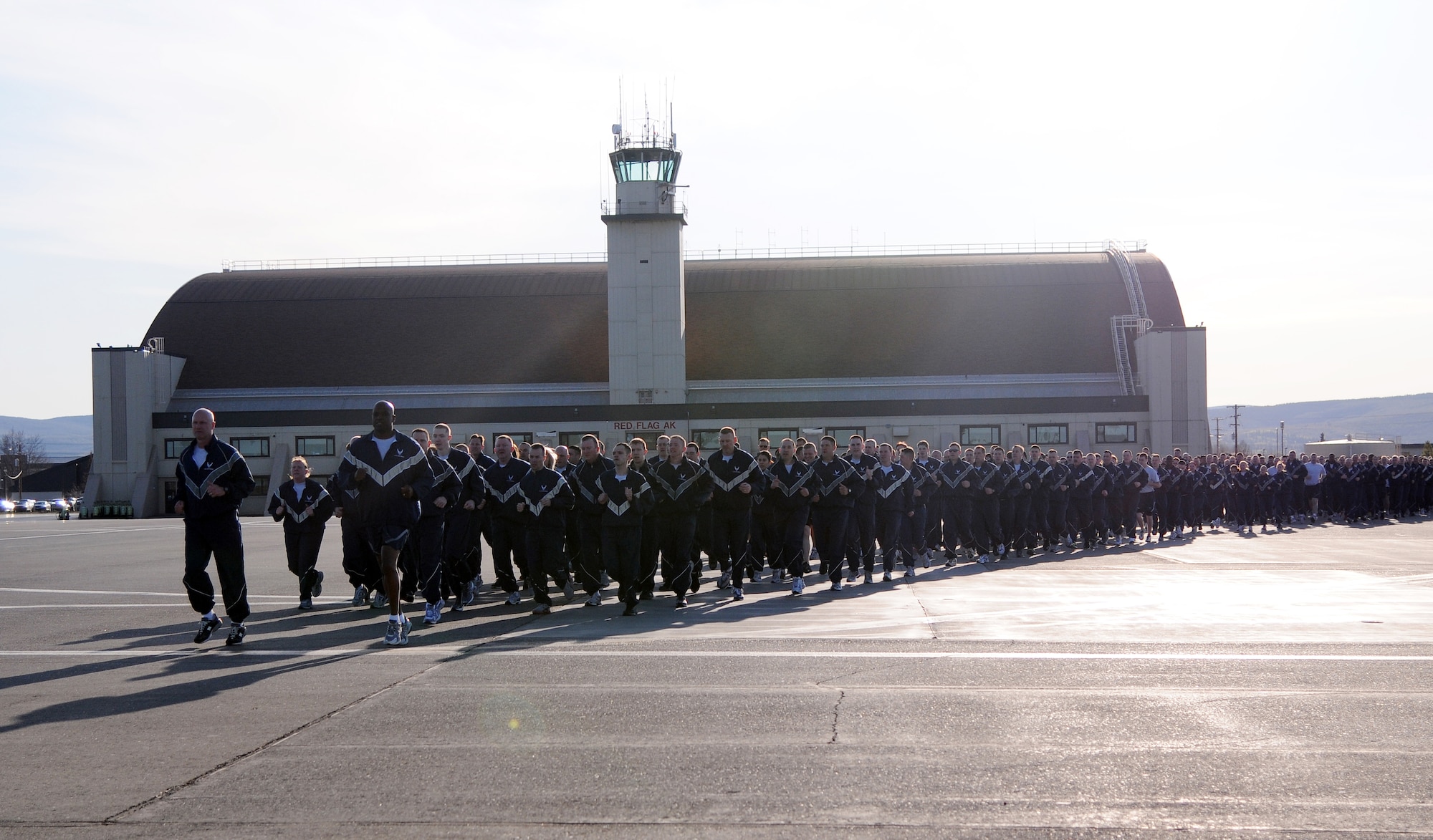 Airmen with the 354th Fighter Wing are led on a run by Brig. Gen. James Post, 354th FW commander, and Chief Master Sergeant Jerry Moore, 354th FW command chief, May 14, 2012, Eielson Air Force Base, Alaska. This event, which included reveille, marked the first wing run of the year. (U.S. Air Force photo/Senior Airman Janine Thibault)