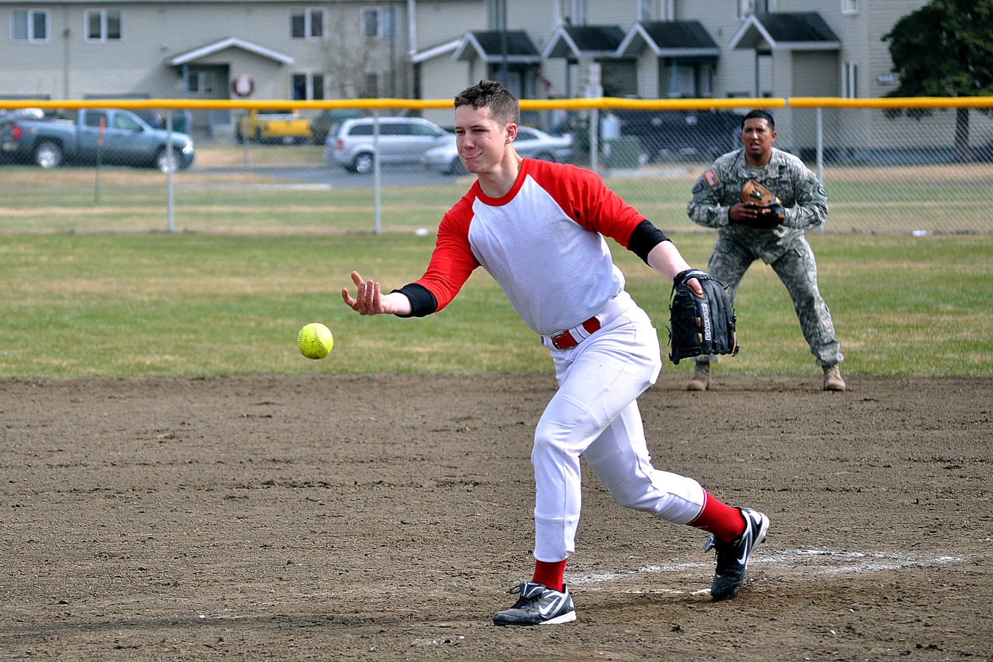 E Troop, 1st Squadron (Airborne), 40th Cavalry Regiment pitcher Mitchell Gehle, tosses an offering toward the plate in the second championship game of the JBER-Richardson pre-season softball tournament Saturday at Buckner Physical Fitness Center?s softball field 3. The 98th Maintenance team stopped E Troop in consecutive games to win the tournament. (U.S. Air Force photo/John Pennell)