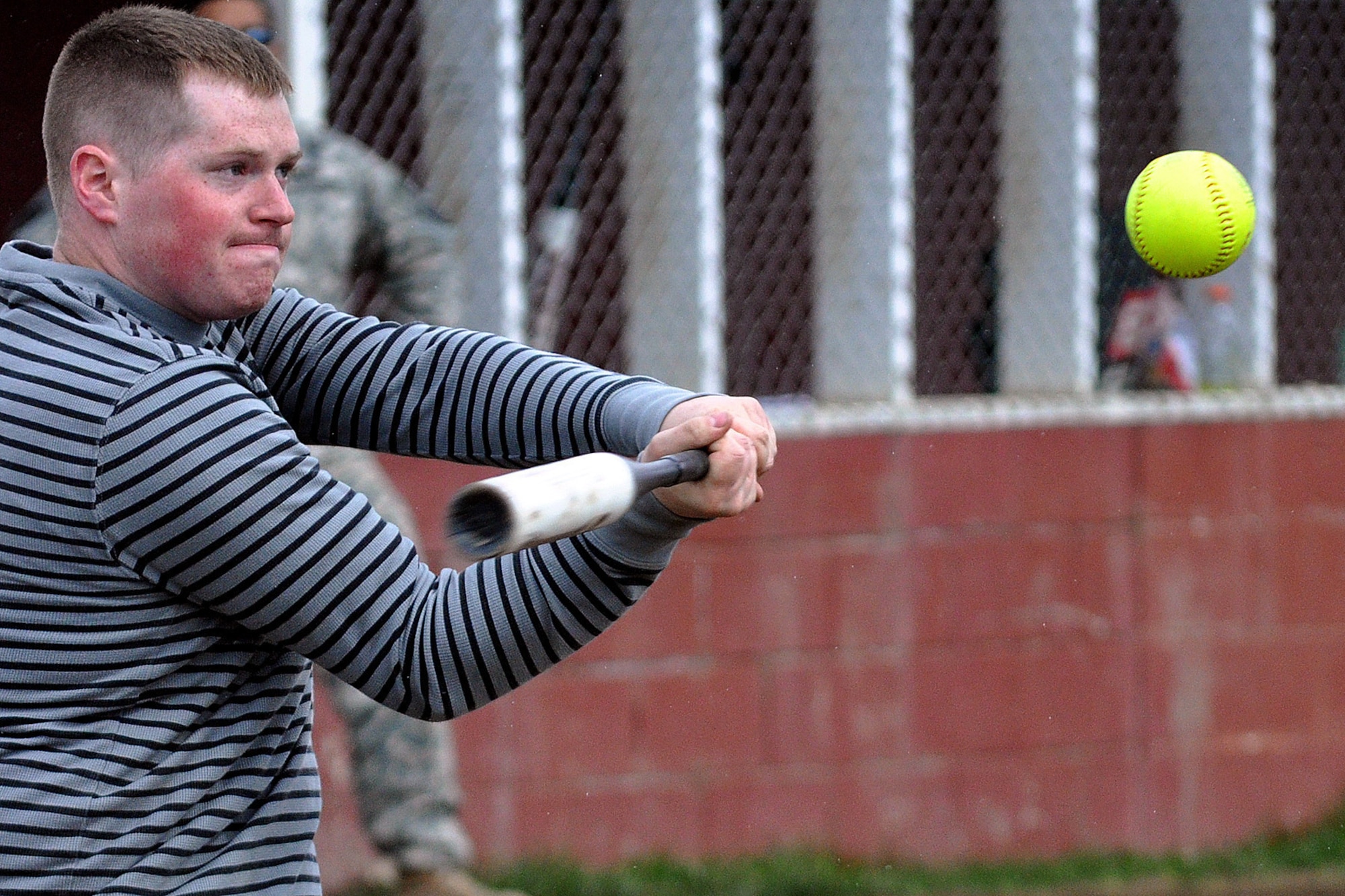 Taylor Berry, 98th Maintenance Company, takes a swing in the first championship game of the JBER-Richardson pre-season softball tournament Saturday at Buckner Physical Fitness Center's softball field 2. The 98th Maintenance team stopped E Troop, 1st Squadron (Airborne), 40th Cavalry Regiment in consecutive games to win the tournament. (U.S. Air Force photo/John Pennell)