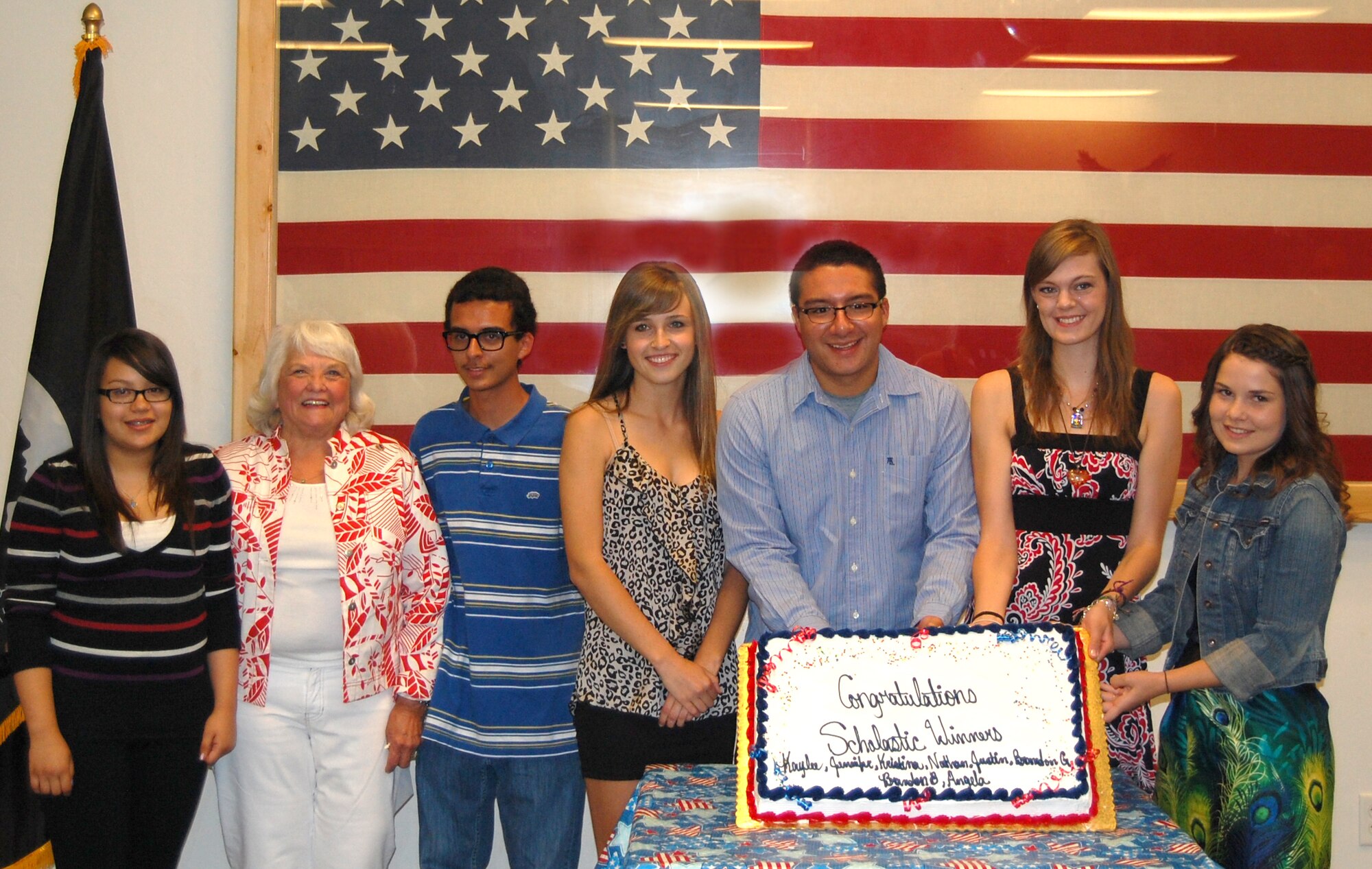 (From the left) Angela Bautista, American Veterans Scholarship Chair Charline Hill, Brandon Barnett, Kaylee McClelland, Nathan Federico, Kristina Farrell, and Jennifer Trueblood celebrate at Tucson’s AMVETS Post 770 Ladies Auxiliary 2012 Scholarship Awards Dinner, May 12. The post awarded seven $500 scholarships and one $100 recognition award to children of 162nd Fighter Wing members. (Scholarship recipients Brandon and Justin Garms are not pictured.) (U.S. Air Force photo/Airman 1st Class Roberto Gonzalez)