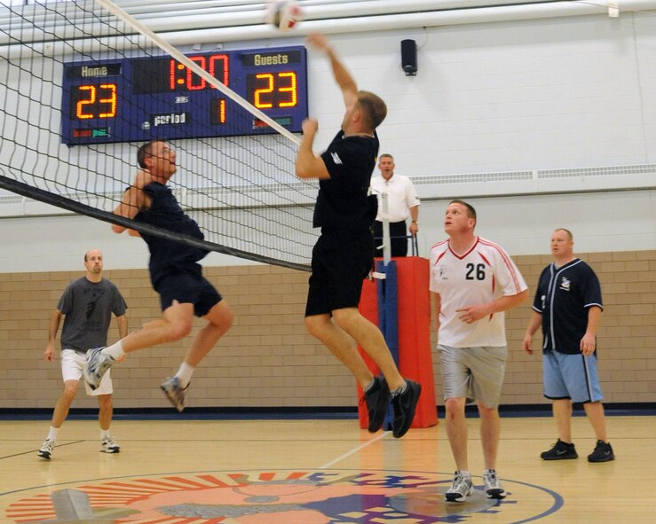 Senior Airman Jonathan Turcotte, 319th Security Forces Squadron, spikes the ball into the opponent’s court on May 5, 2012, at Grand Forks Air Force Base, N.D., during the intramural season championship match. Security Forces beat the Spouse’s team to take the title.  (U.S. Air Force photo by Airman 1st Class Xavier Navarro)