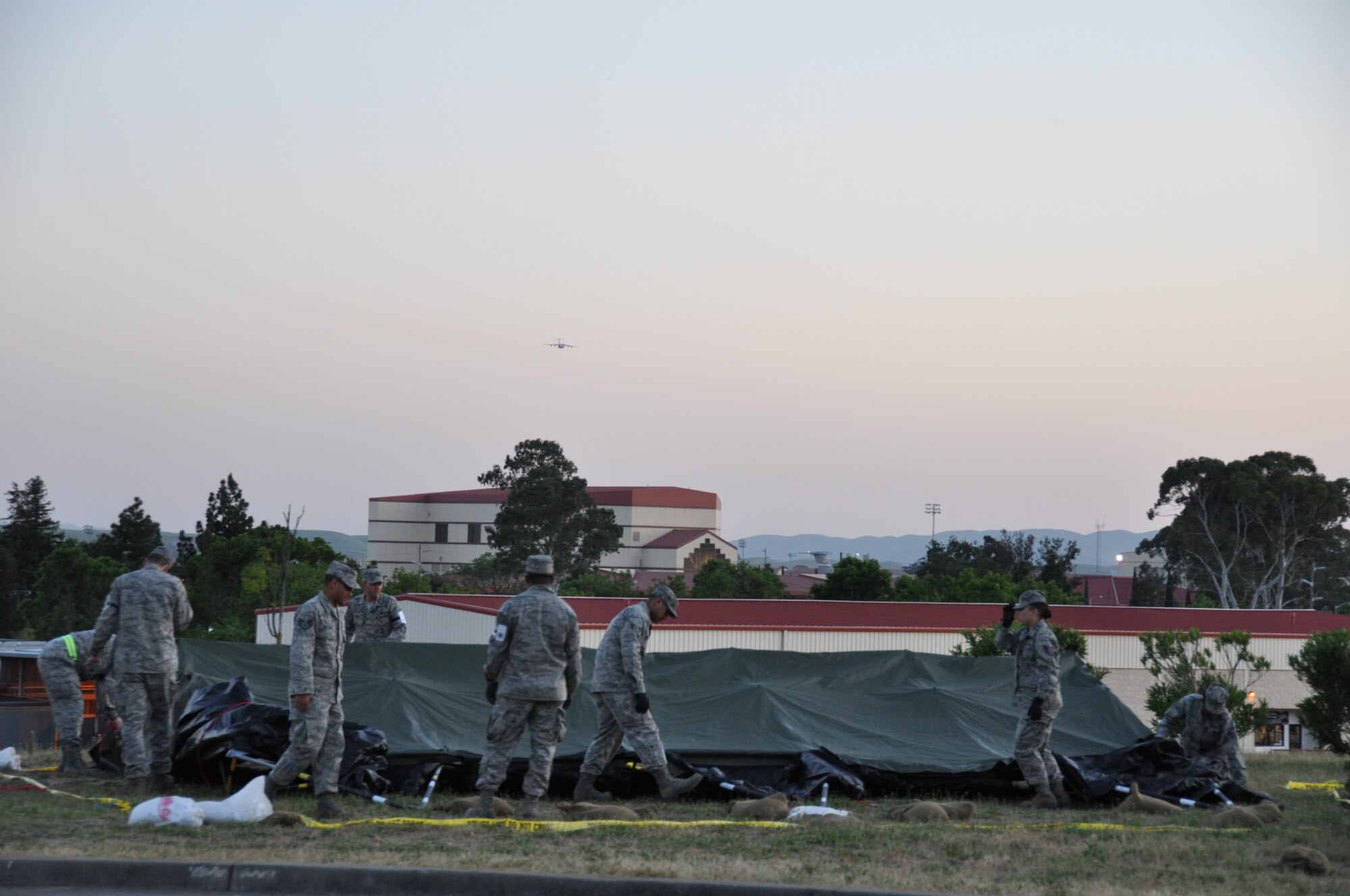 TRAVIS AIR FORCE BASE, Calif. -- Members of the 349th Air Mobility Wing and 60th AMW teamed up in an Operational Readiness Exercise here during the week of May 7, 2012. During the six-day –long mock deployment, Airmen utilized their extensive training in post-attack reconnaissance, self-aid buddy care, defensive tactical warfare, and chemical warfare mission oriented protective posture, (MOPP,) while maintaining their ability to work in their respective career fields. (U.S. Air Force photo / Senior Airman Amelia Leonard)